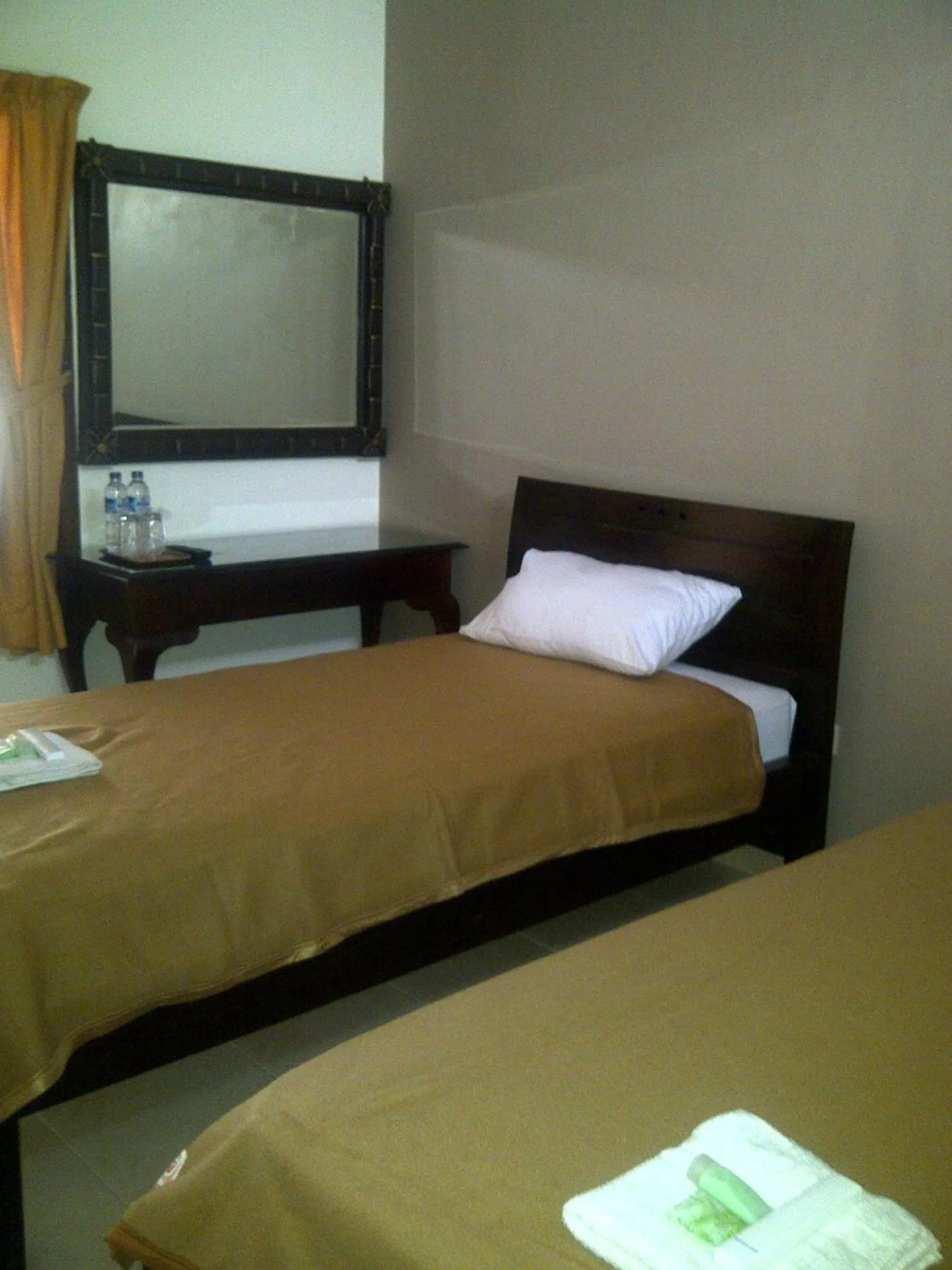 Bed in Ndalem Suratin Guesthouse