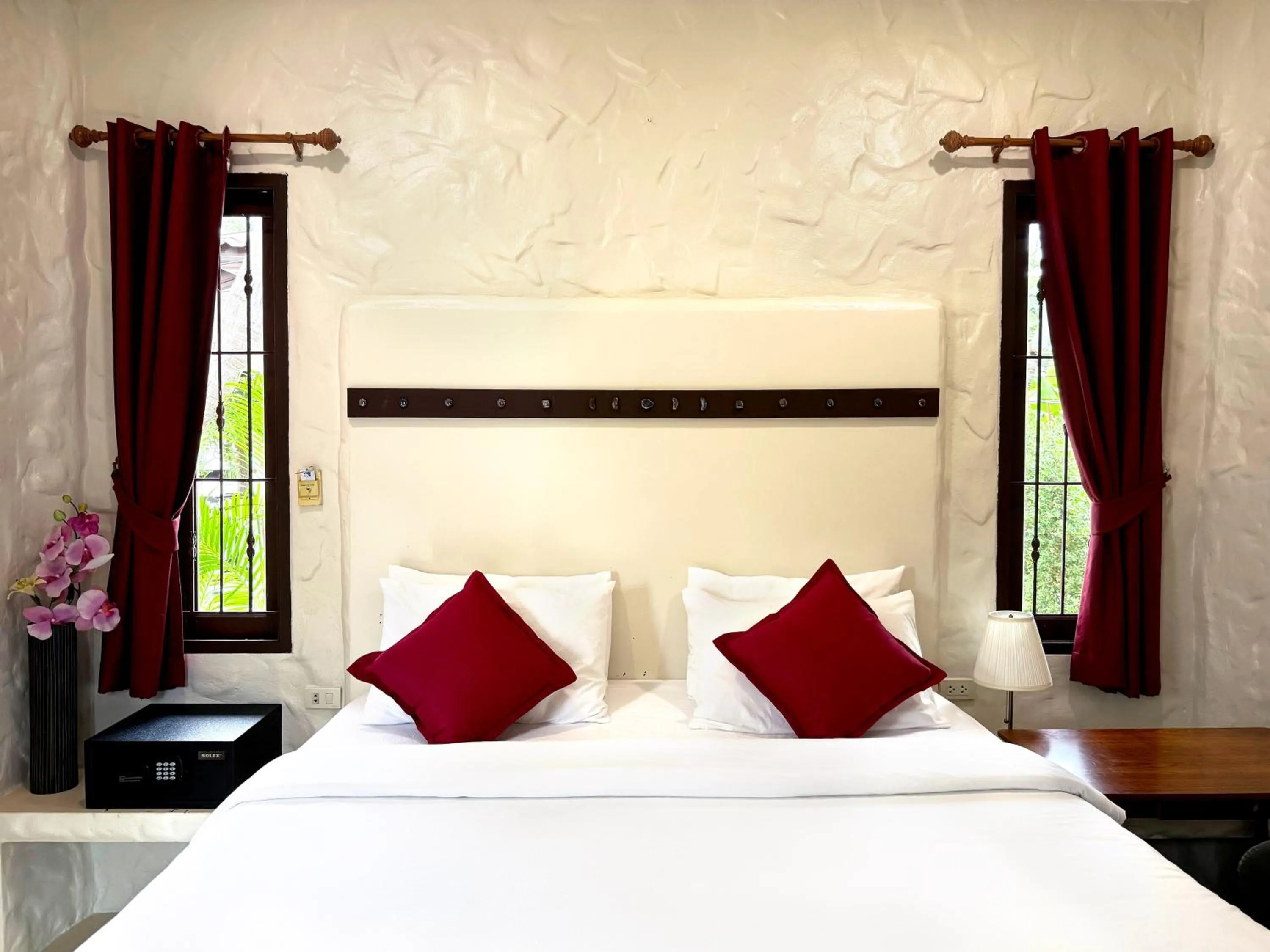 Bed in Sabaii Bay Resort