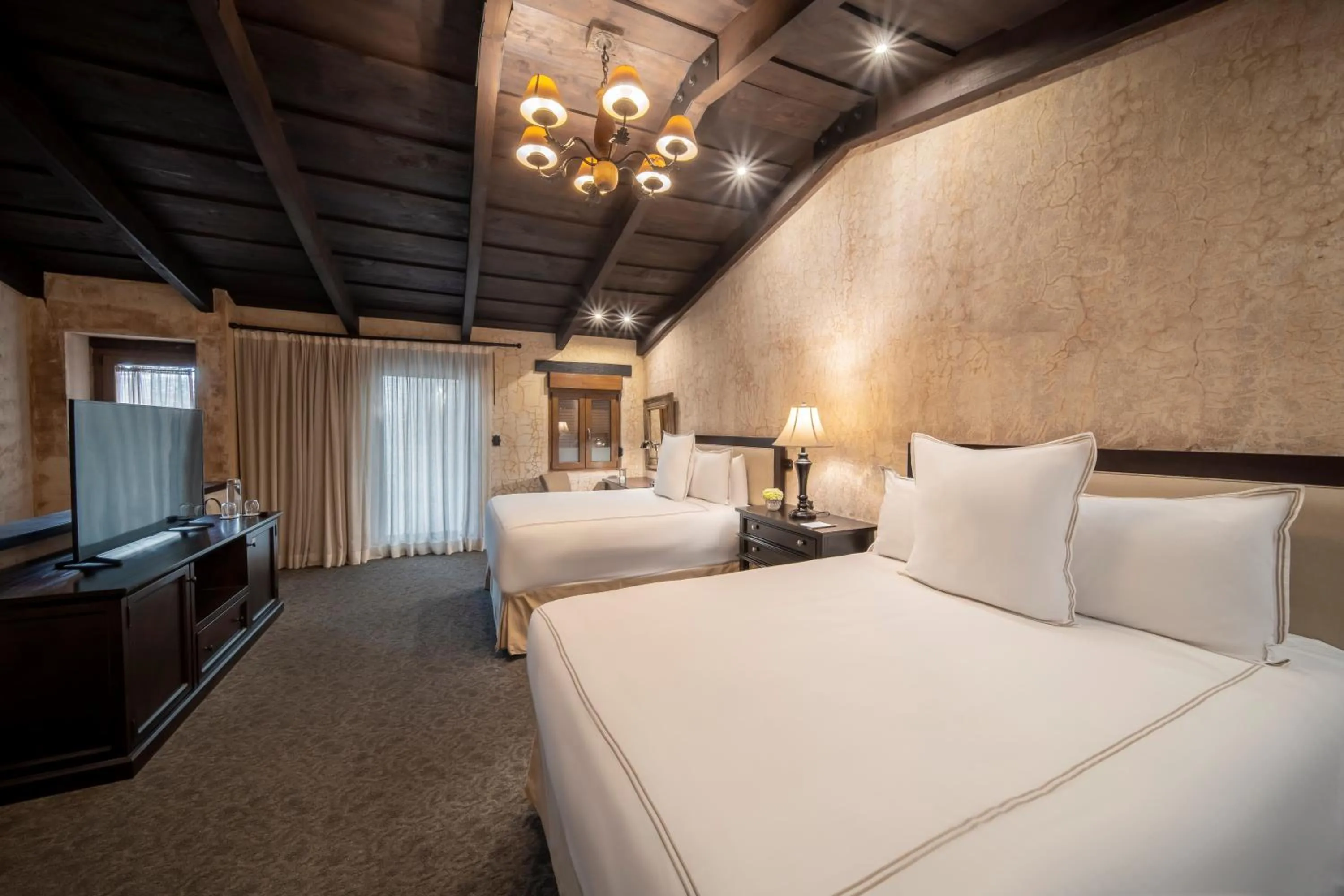 Bed in El Convento Boutique Hotel