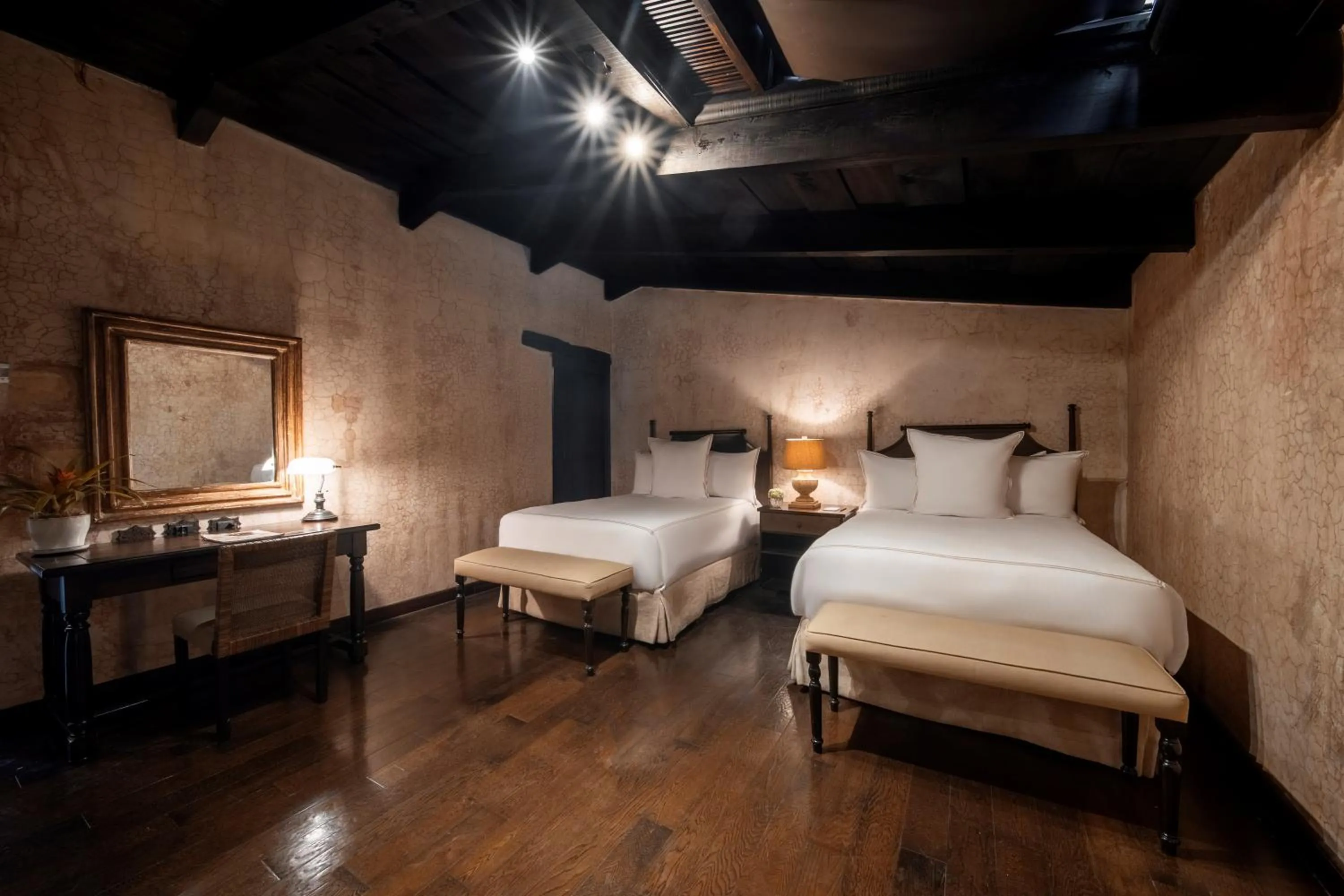 Bed in El Convento Boutique Hotel