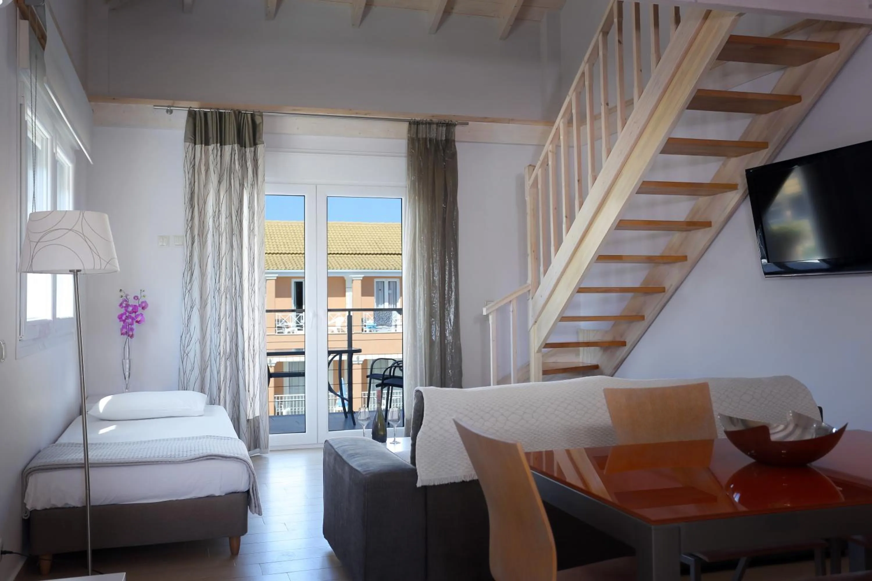 Living room, Bed in Kavos Plaza Hotel