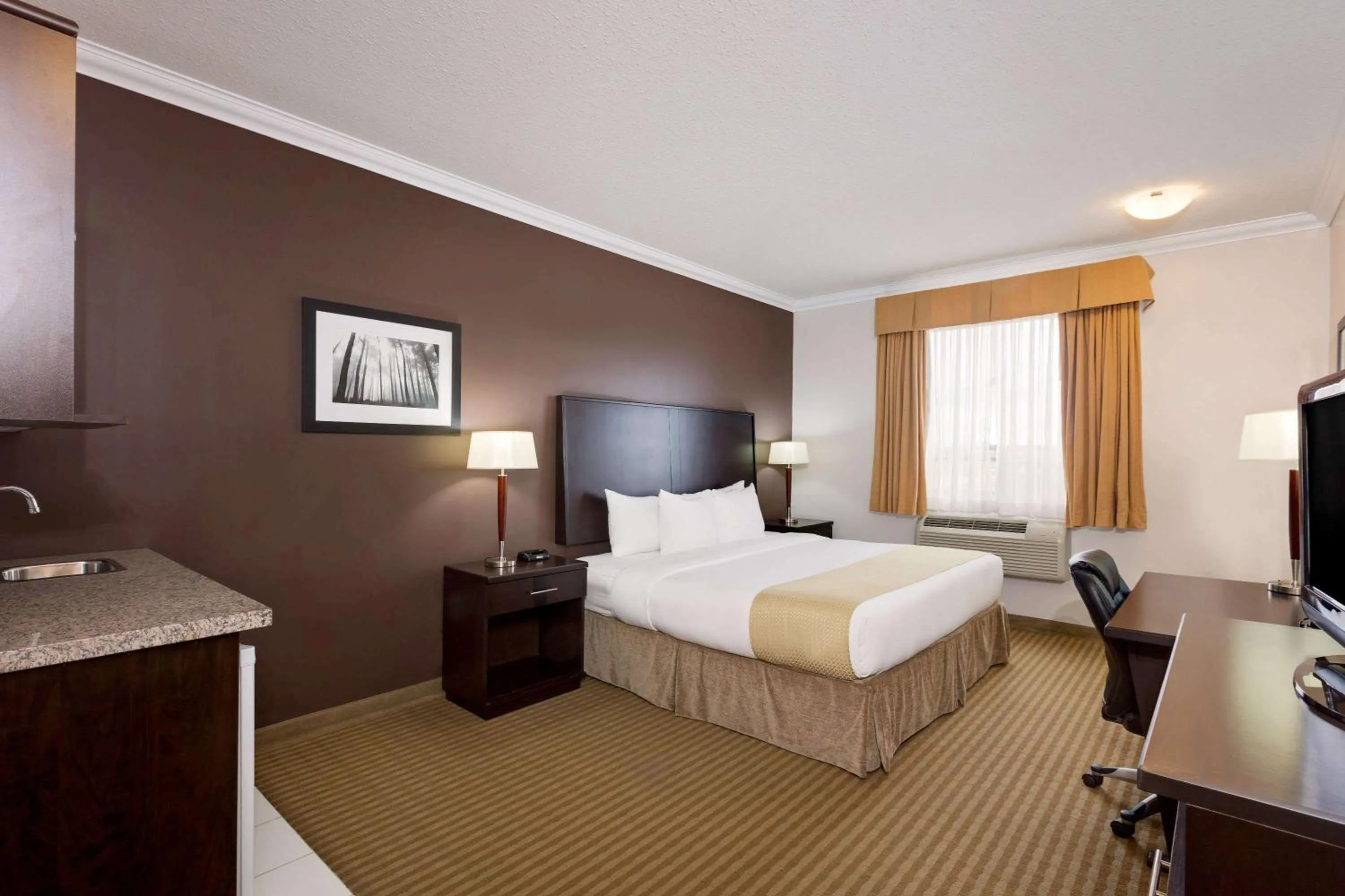 Photo of the whole room, Bed in Ramada by Wyndham Cold Lake