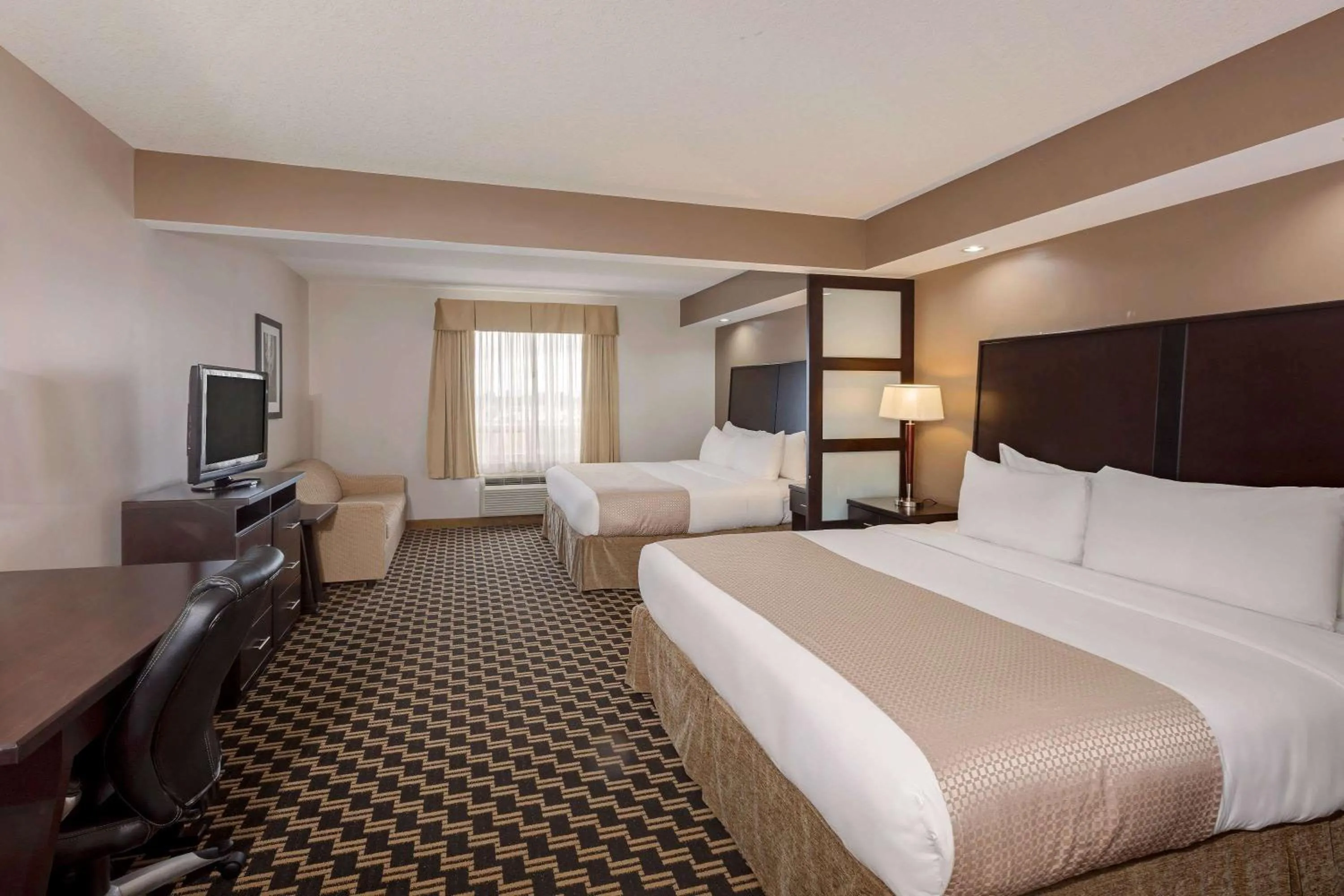Photo of the whole room, Bed in Ramada by Wyndham Cold Lake