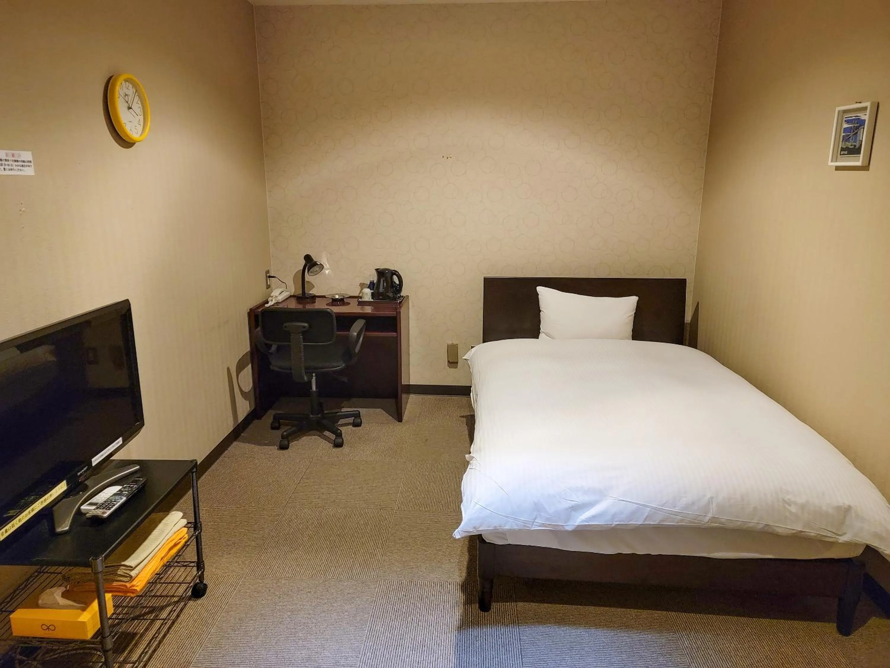 Photo of the whole room, Bed in First Inn Takamatsu