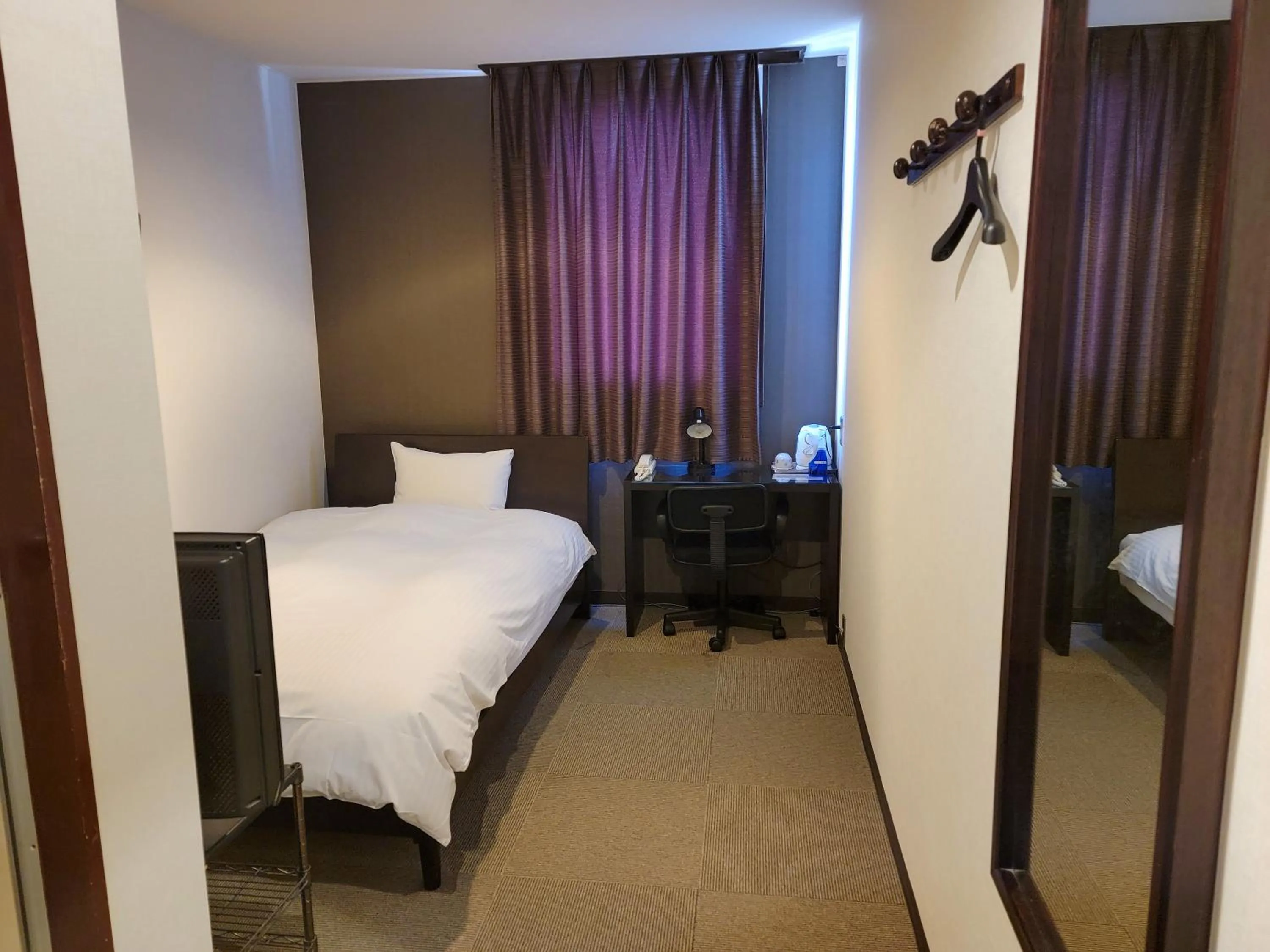 Photo of the whole room, Bed in First Inn Takamatsu