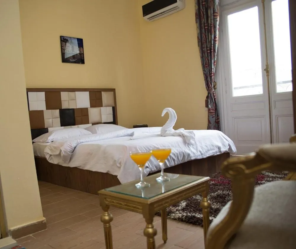 Bed in New Grand Royal Hotel Cairo