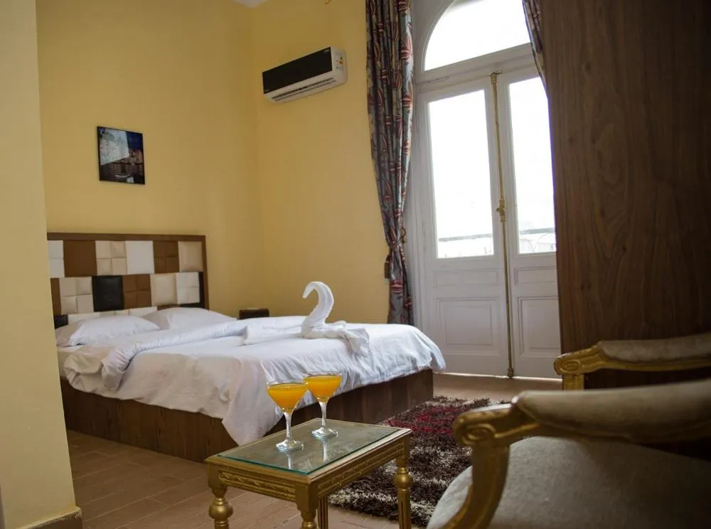 Bed in New Grand Royal Hotel Cairo