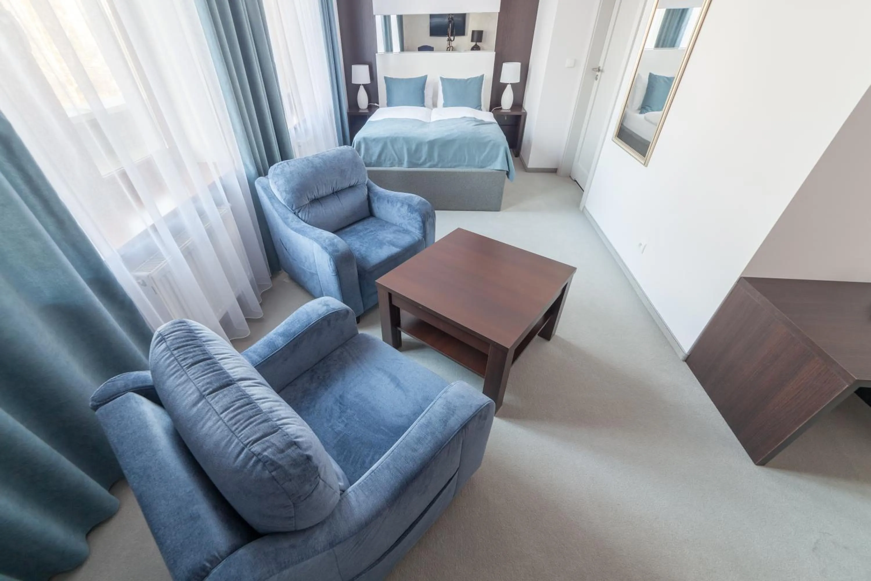 Living room, Bed in Novopolska - Hotel i Restauracja