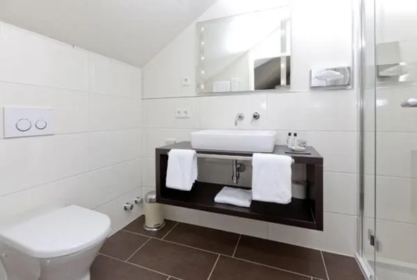 Bathroom in Restaurant Niedmühle Land & Genuss Hotel