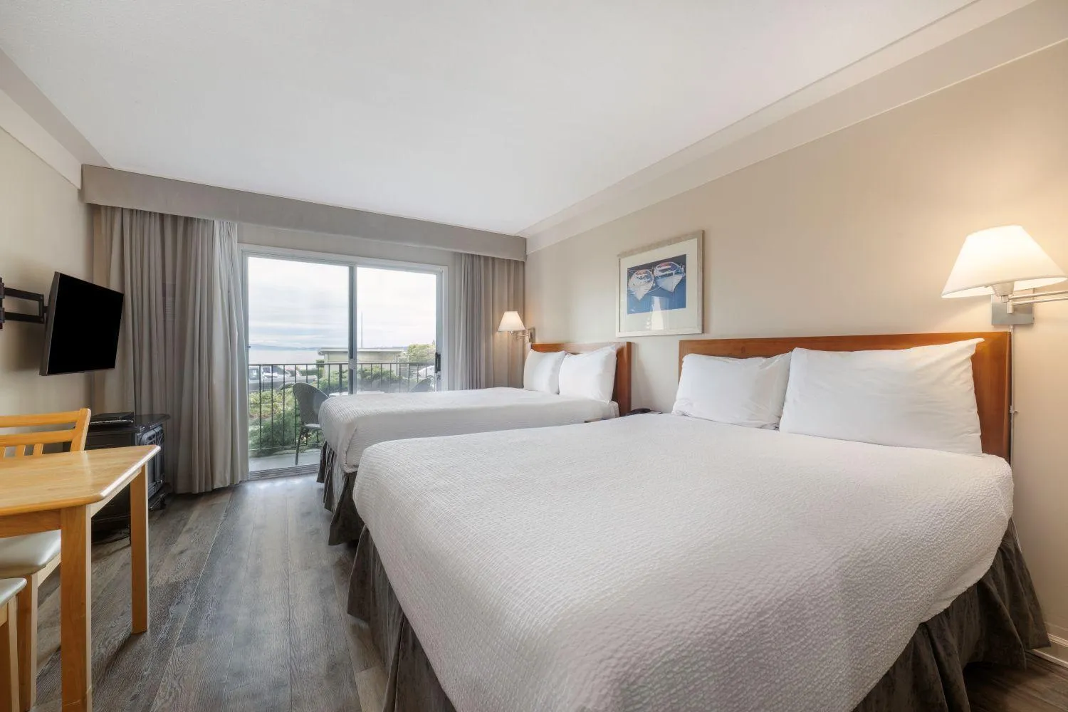 Bed in Sidney Waterfront Inn & Suites