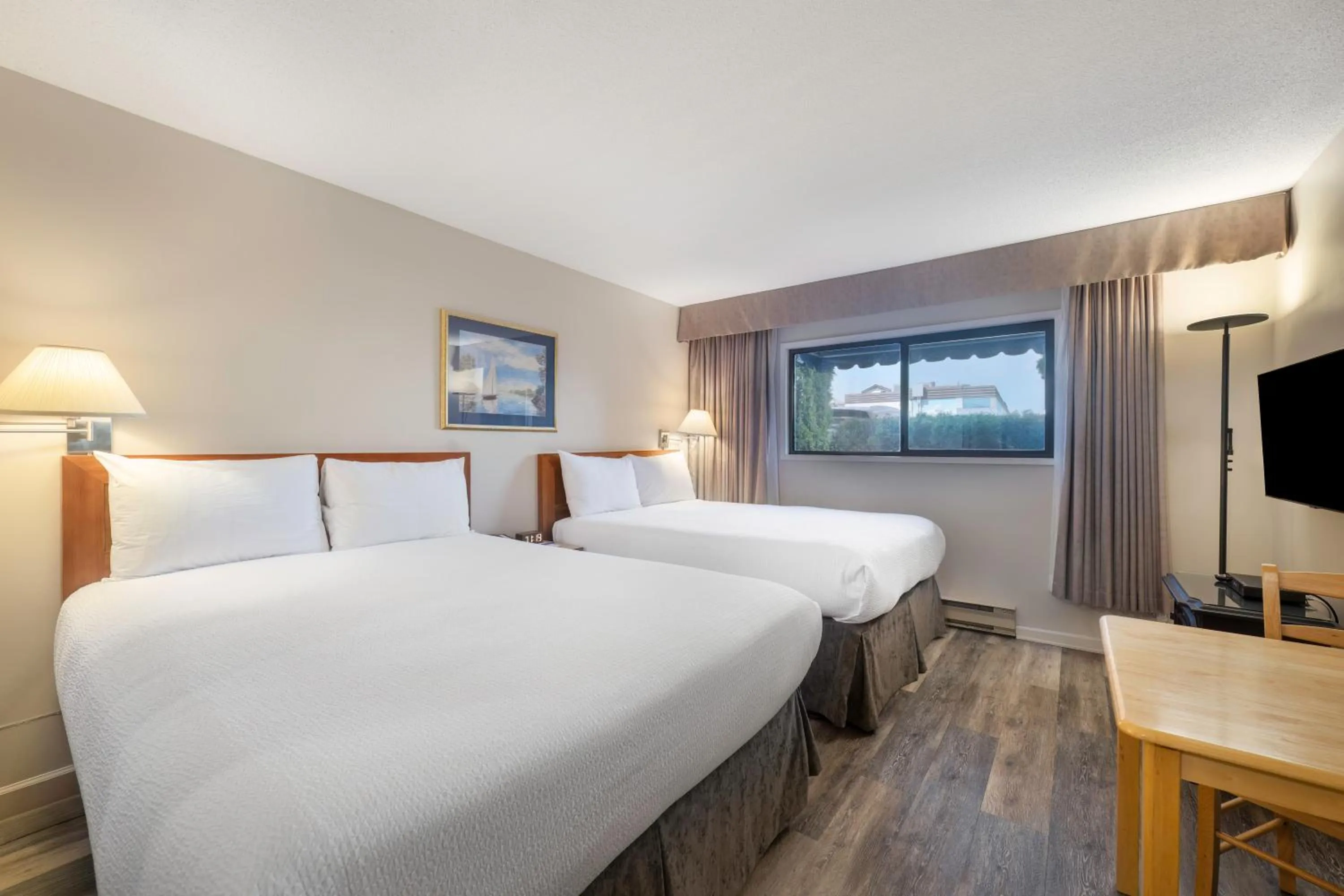 Bed in Sidney Waterfront Inn & Suites