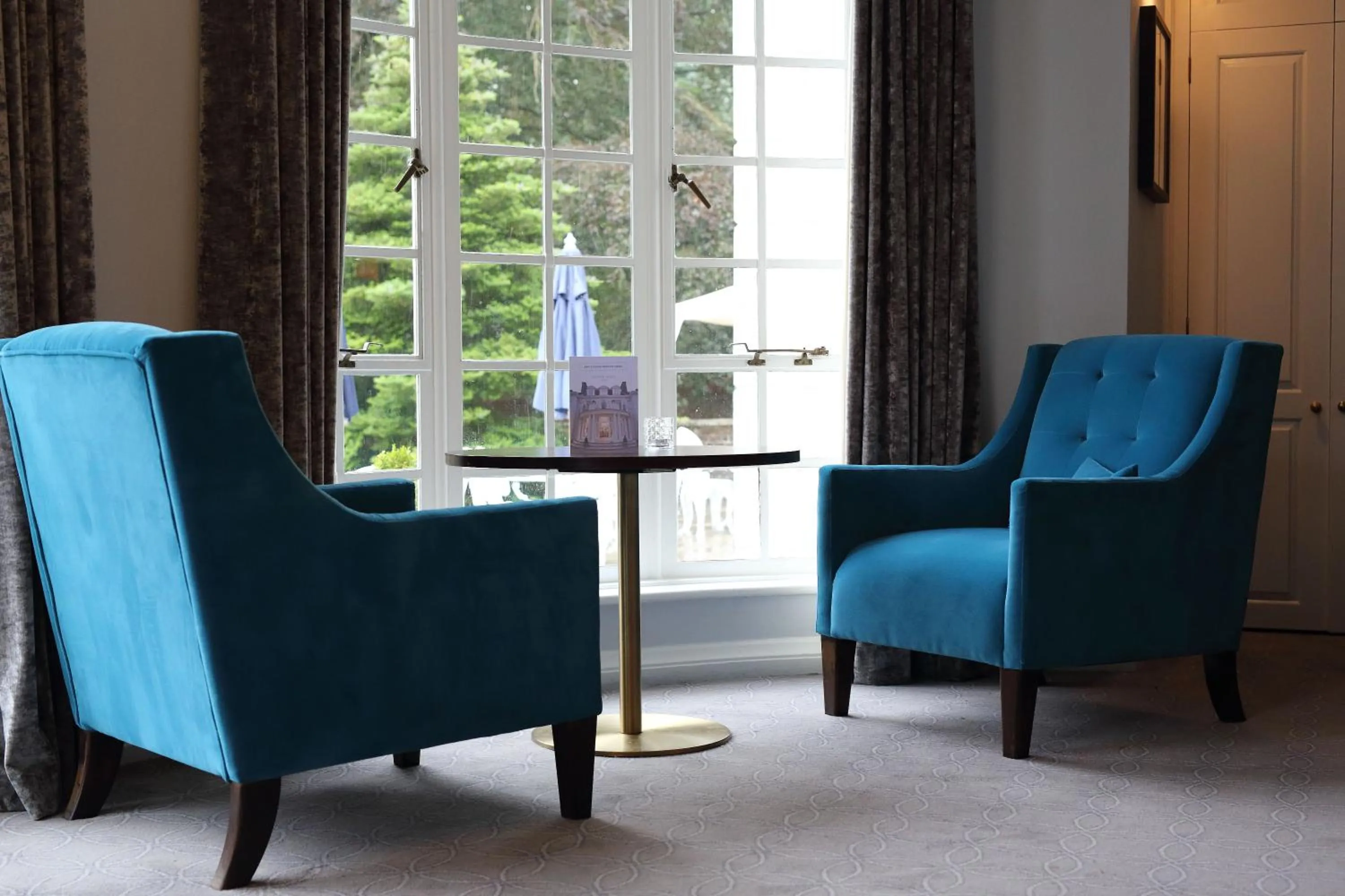 Communal lounge/ TV room in Gorse Hill Hotel