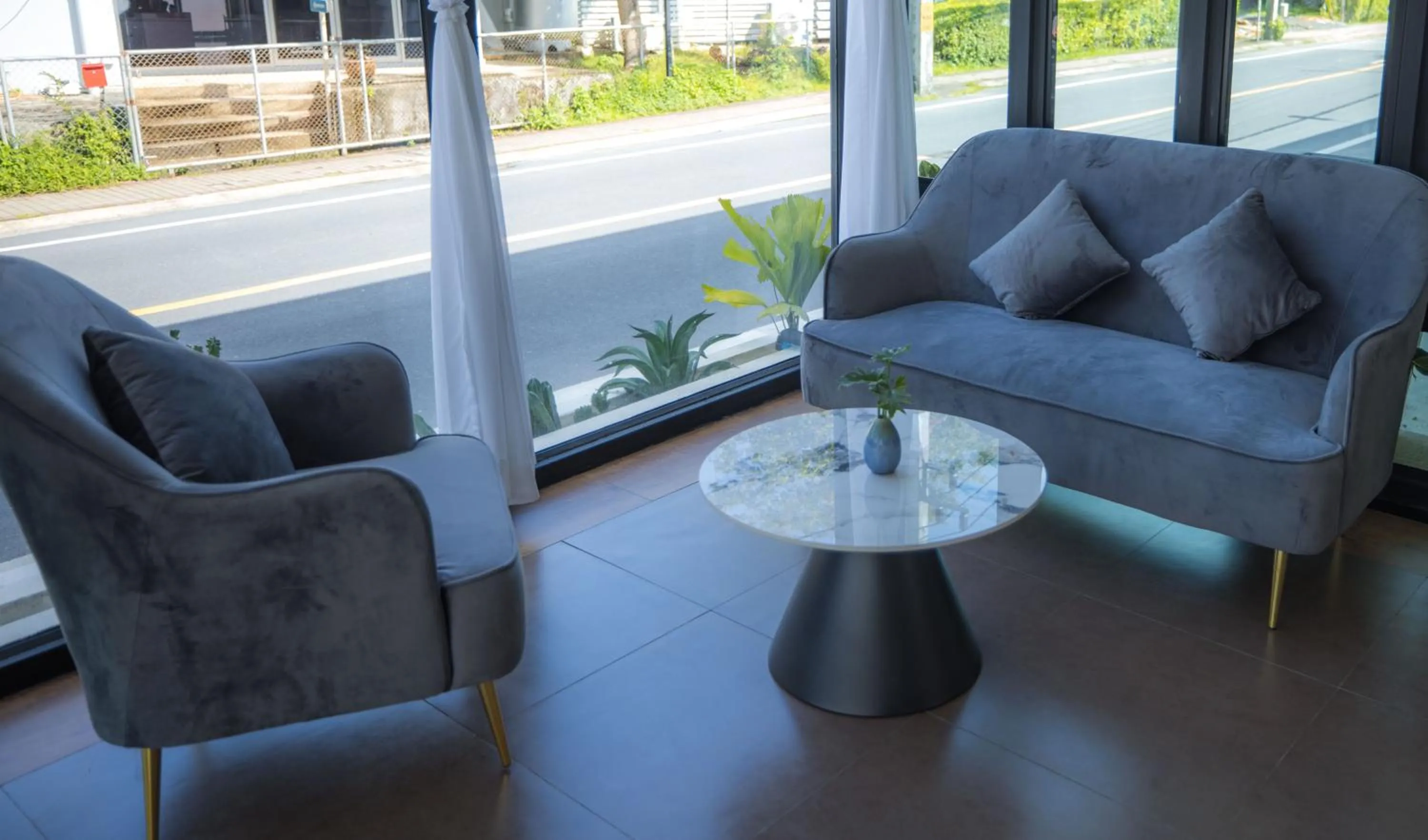 Communal lounge/ TV room in Blue Carina Hotel Phuket