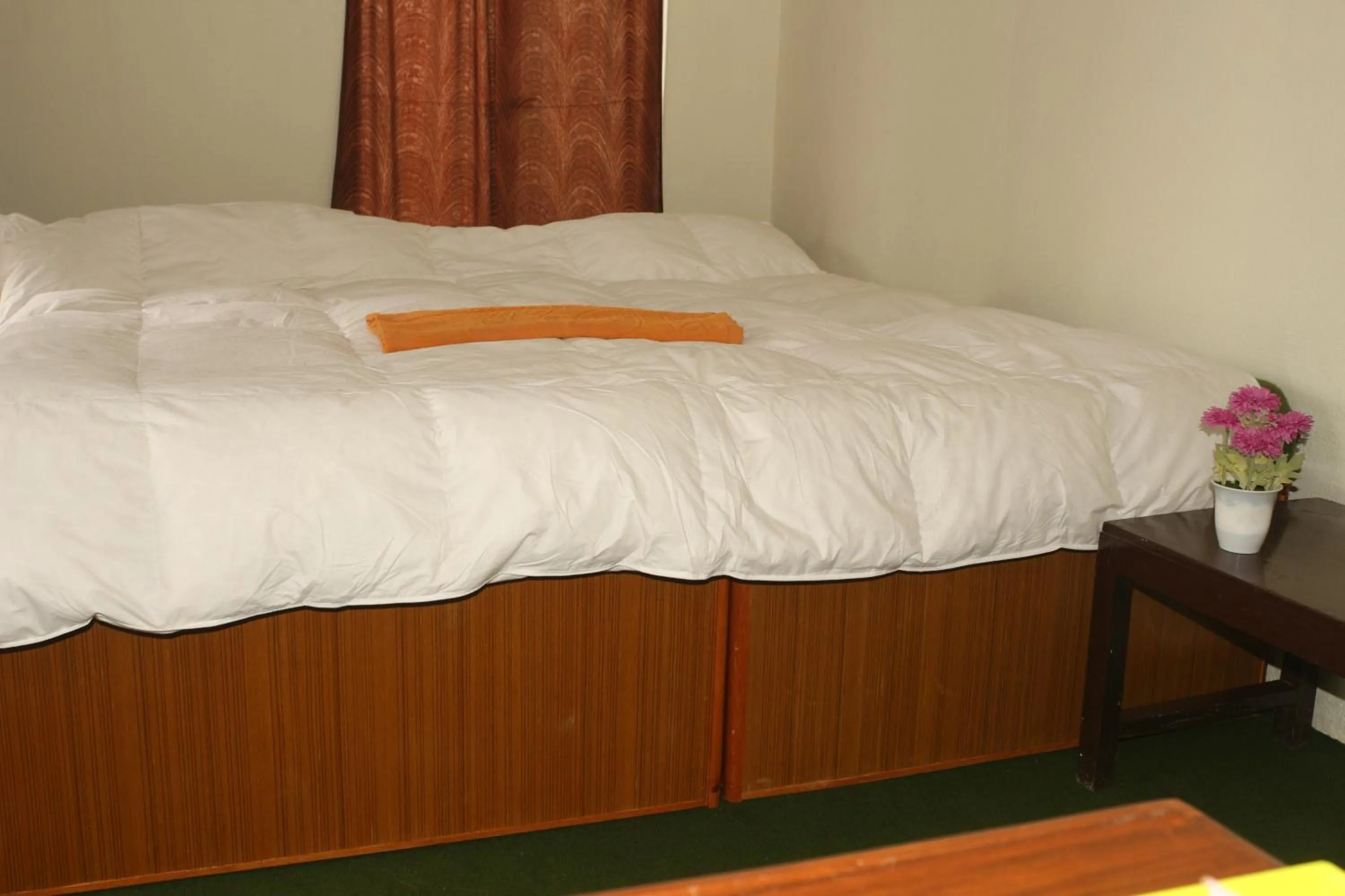 Bed in Gurkha Lodge