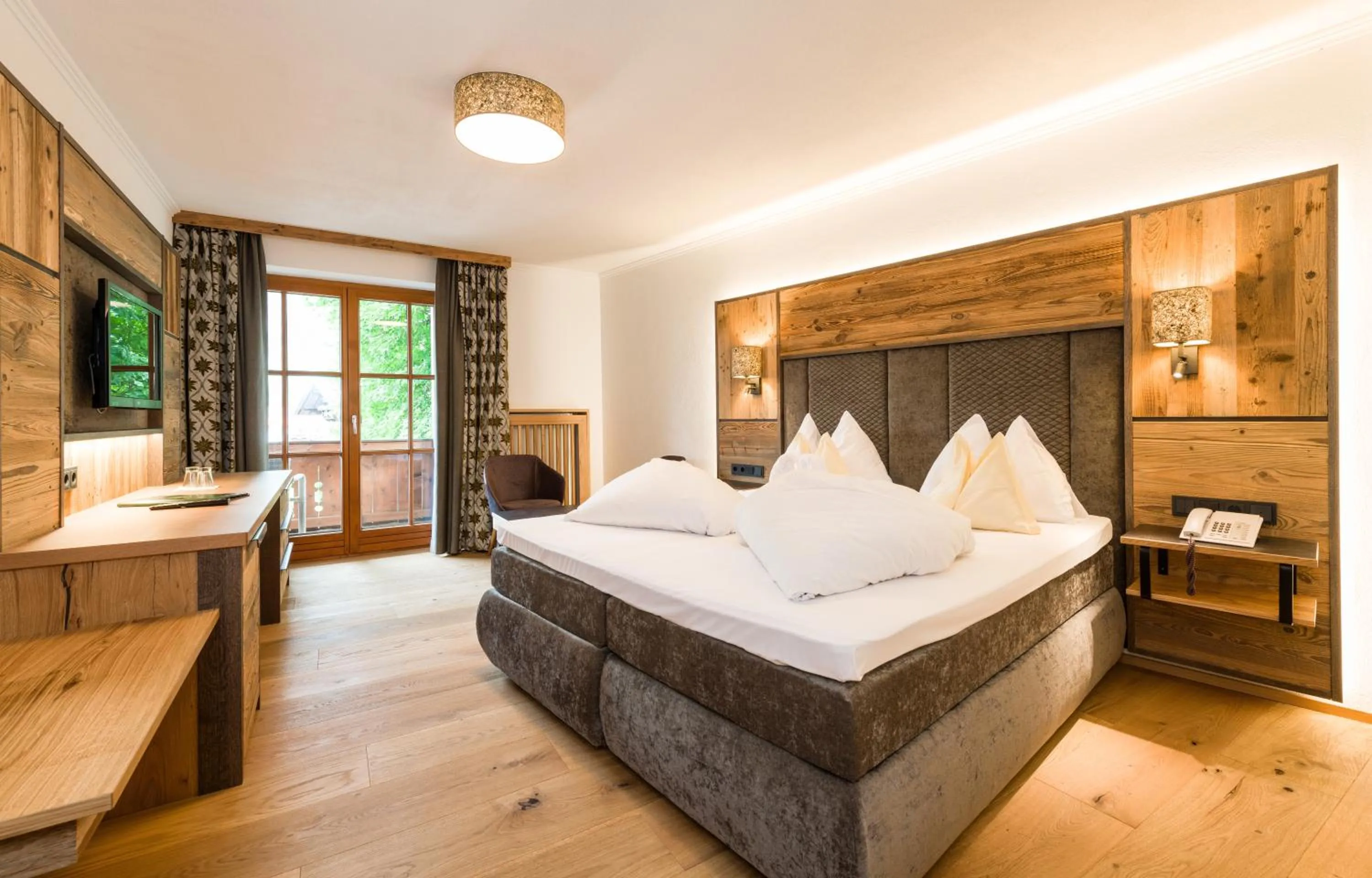 Photo of the whole room, Bed in Wellness & Sporthotel Alpenhof