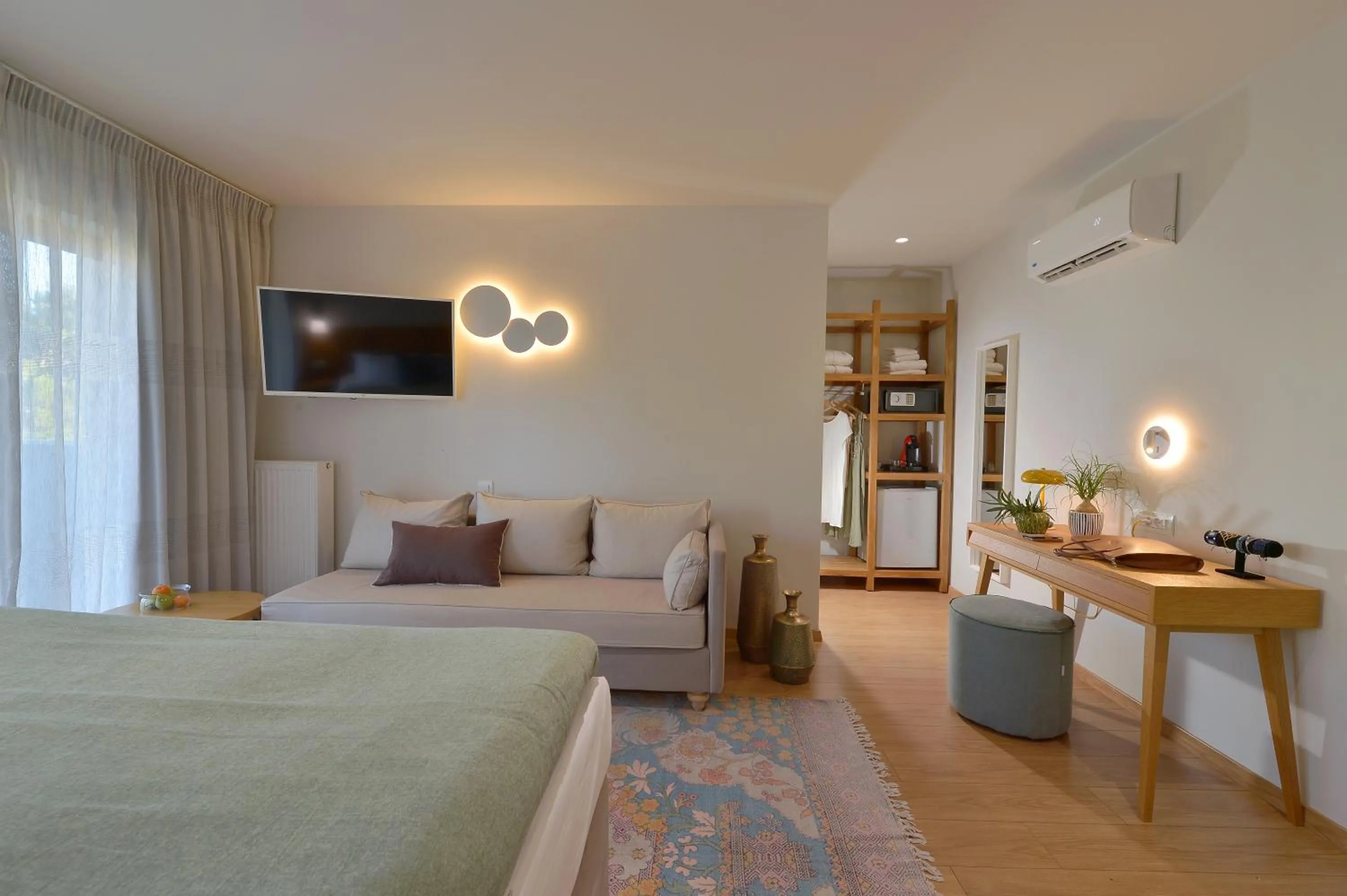 Seating area, Bed in MIRIVILI hospitality & wellness