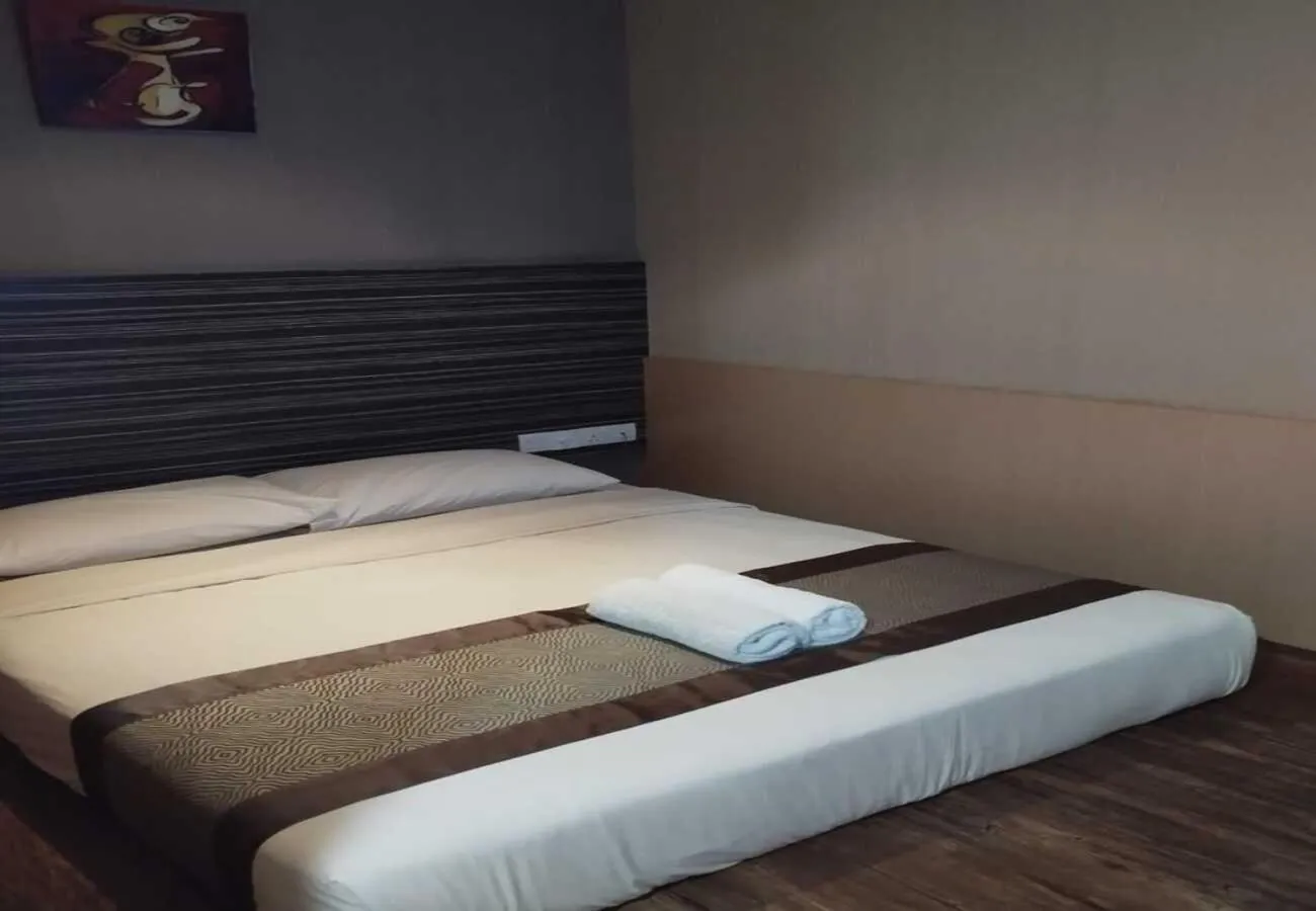 Bed in Hotel Austin Paradise