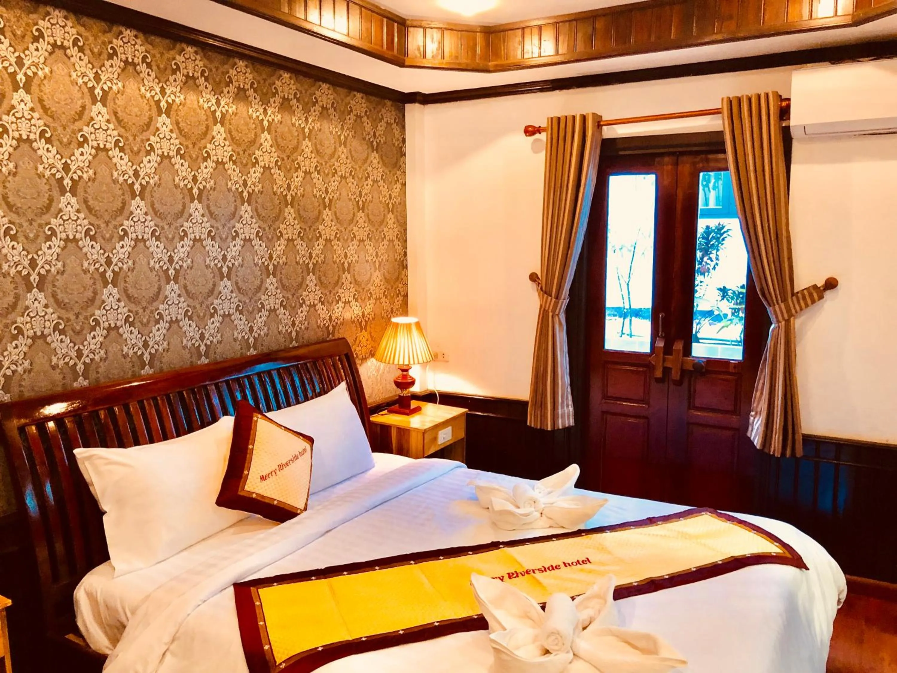 Photo of the whole room, Bed in Merry Riverside Hotel