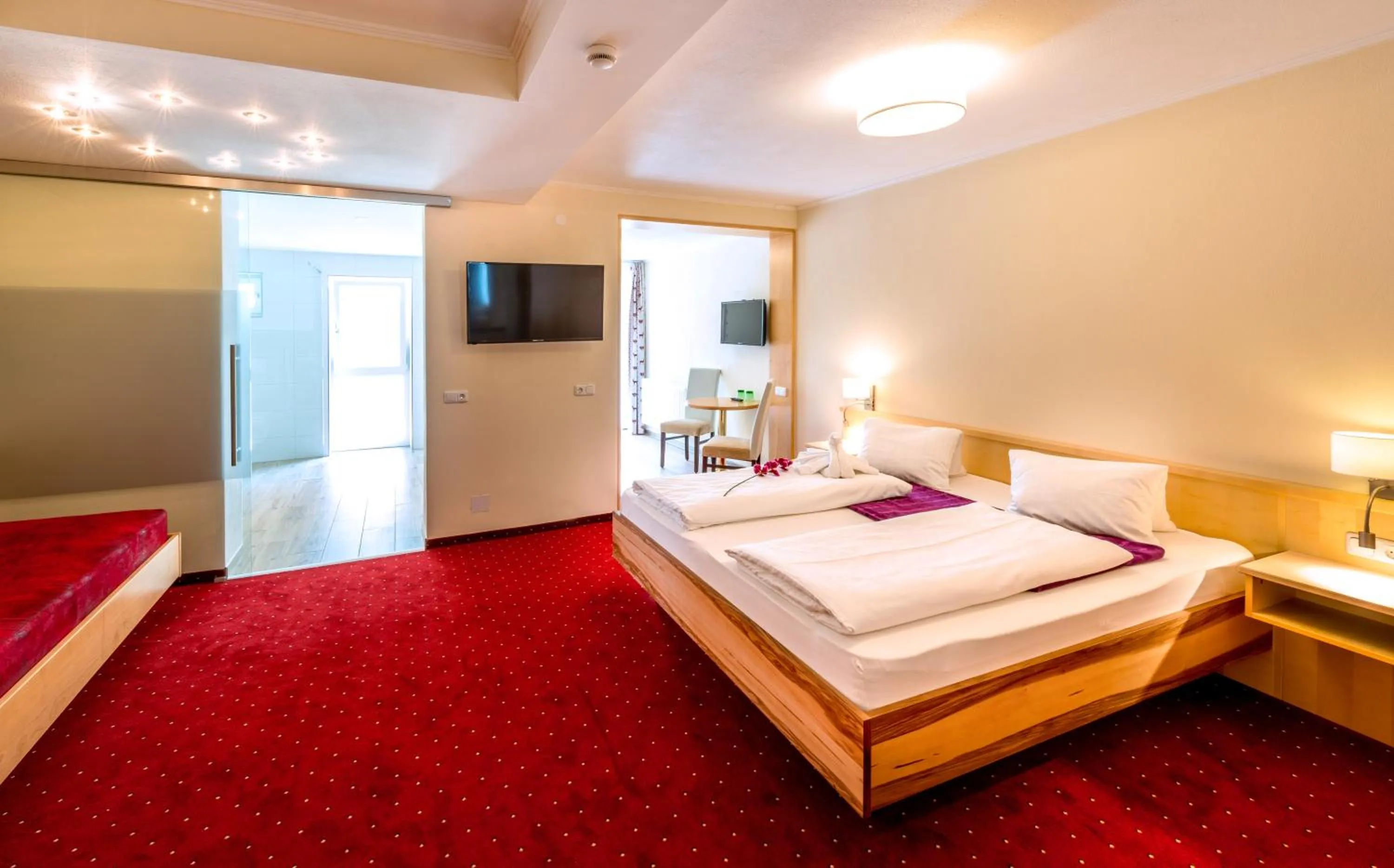 Photo of the whole room, Bed in Panorama Hotel Traunstein