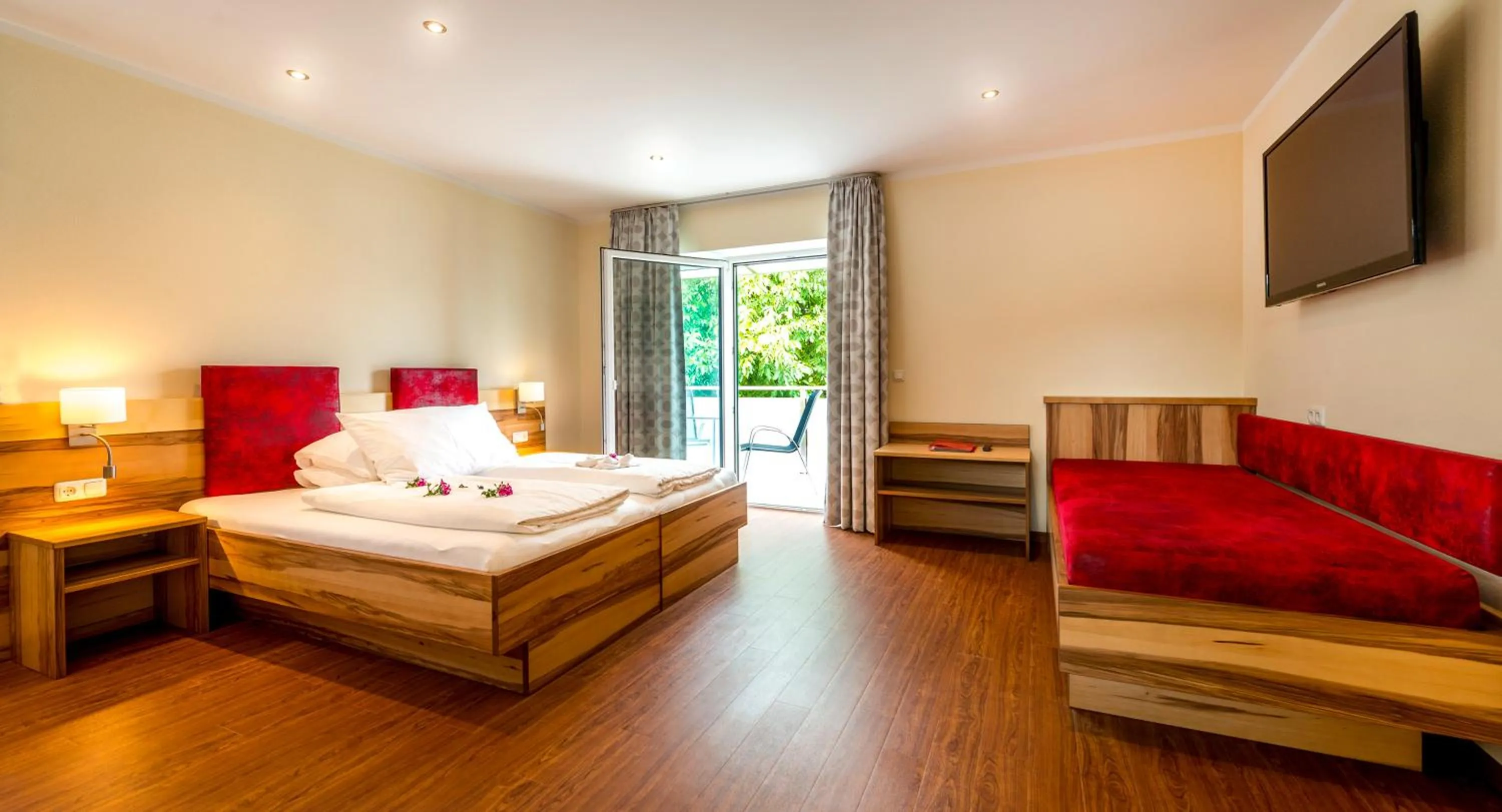 Photo of the whole room, Bed in Panorama Hotel Traunstein