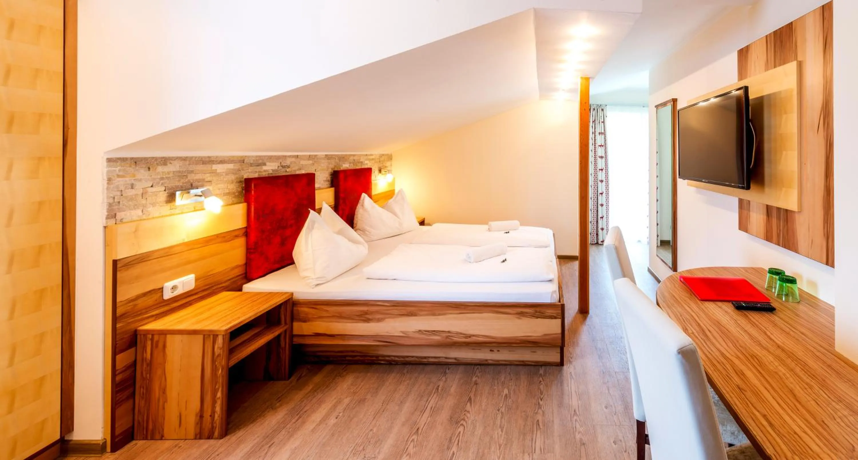 Photo of the whole room, Bed in Panorama Hotel Traunstein