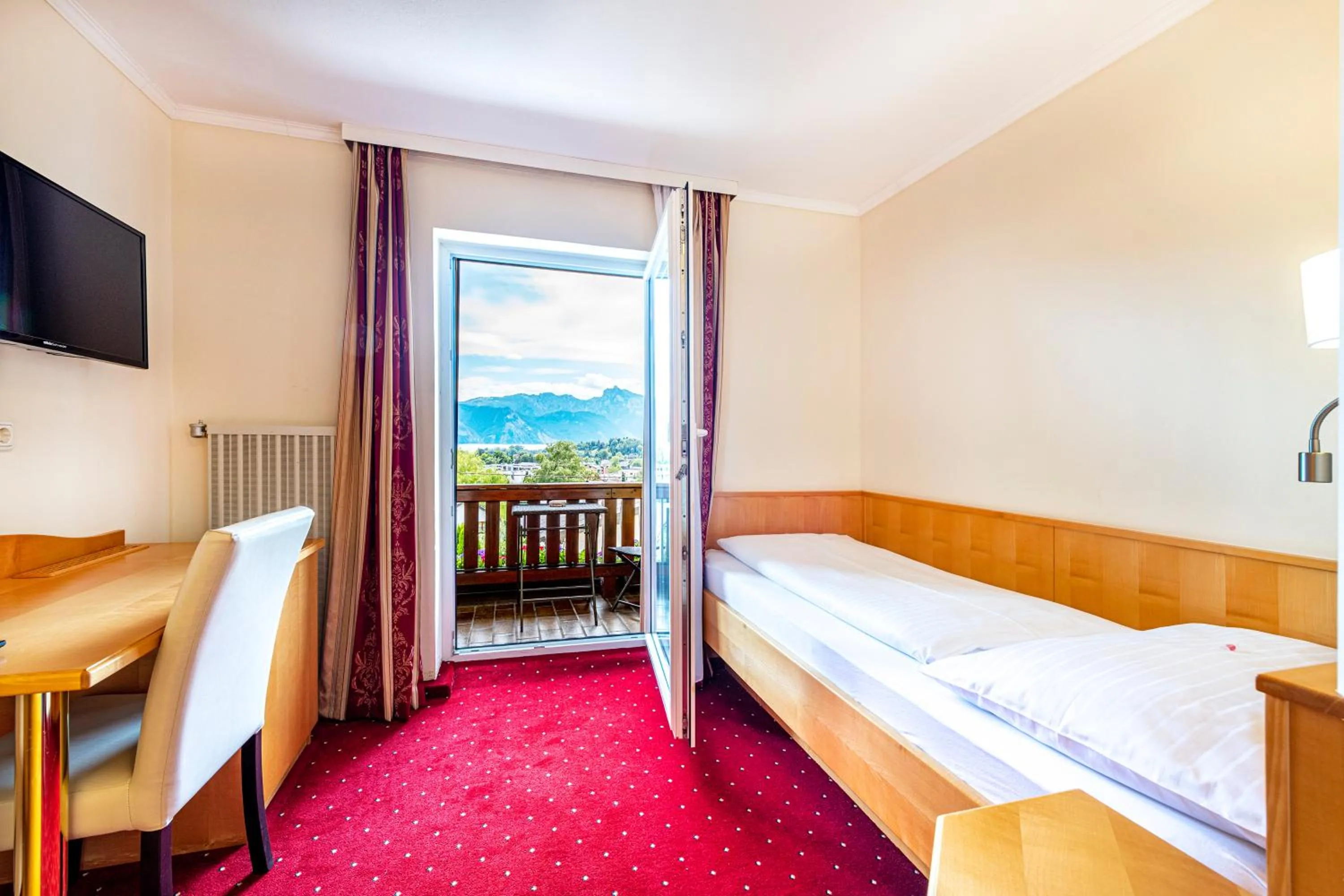 Photo of the whole room, Bed in Panorama Hotel Traunstein