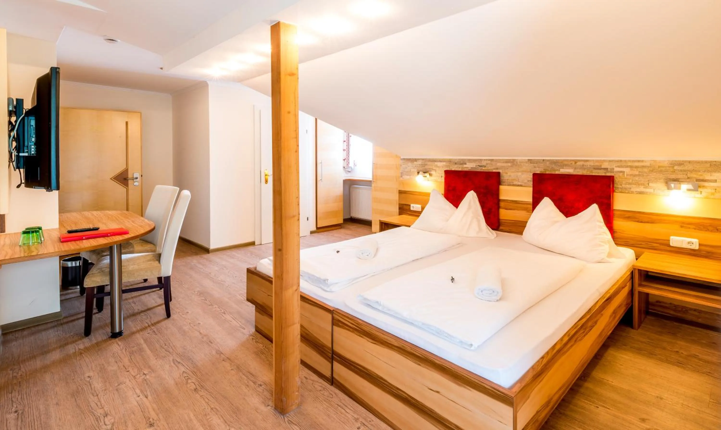 Photo of the whole room, Bed in Panorama Hotel Traunstein