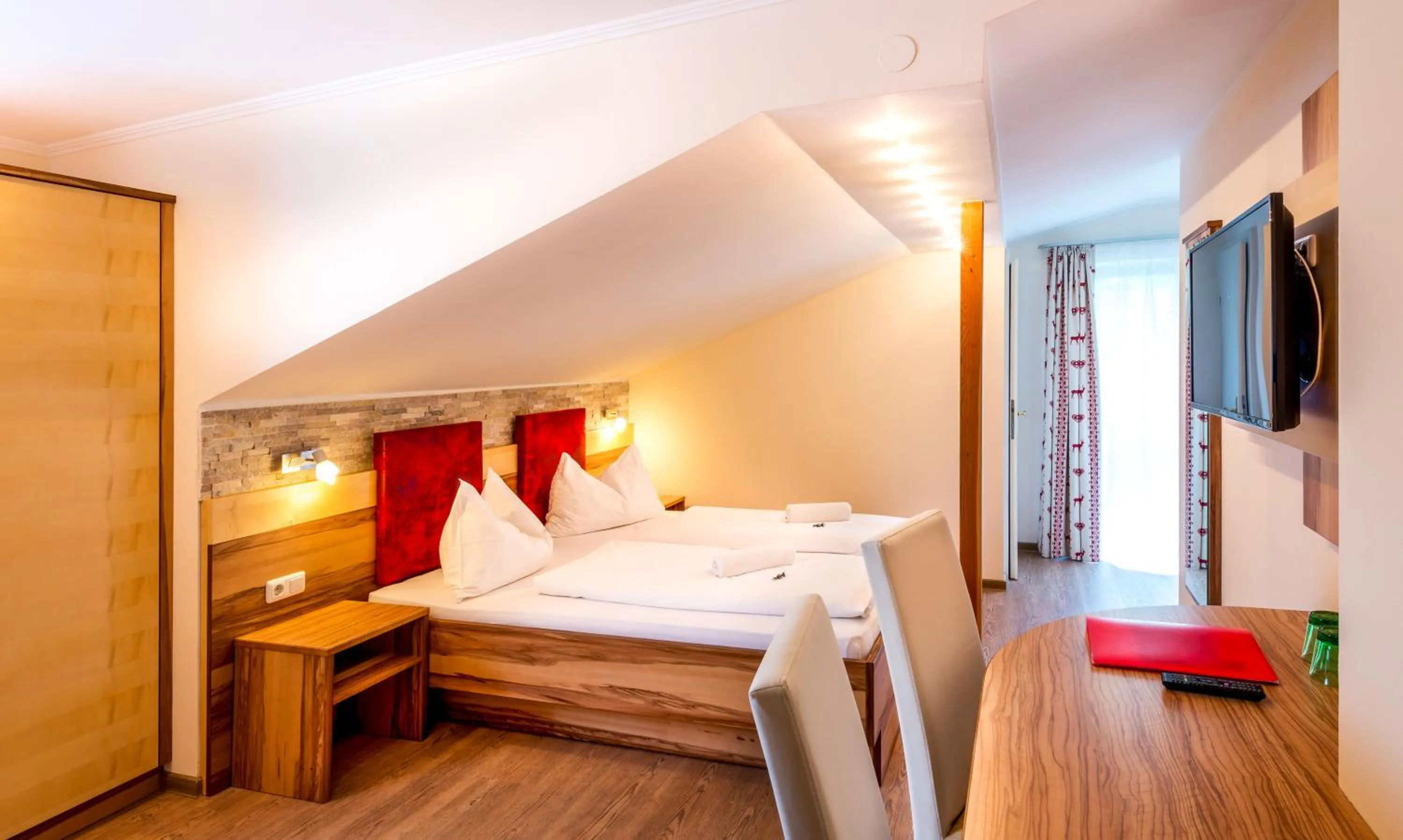 Photo of the whole room, Bed in Panorama Hotel Traunstein