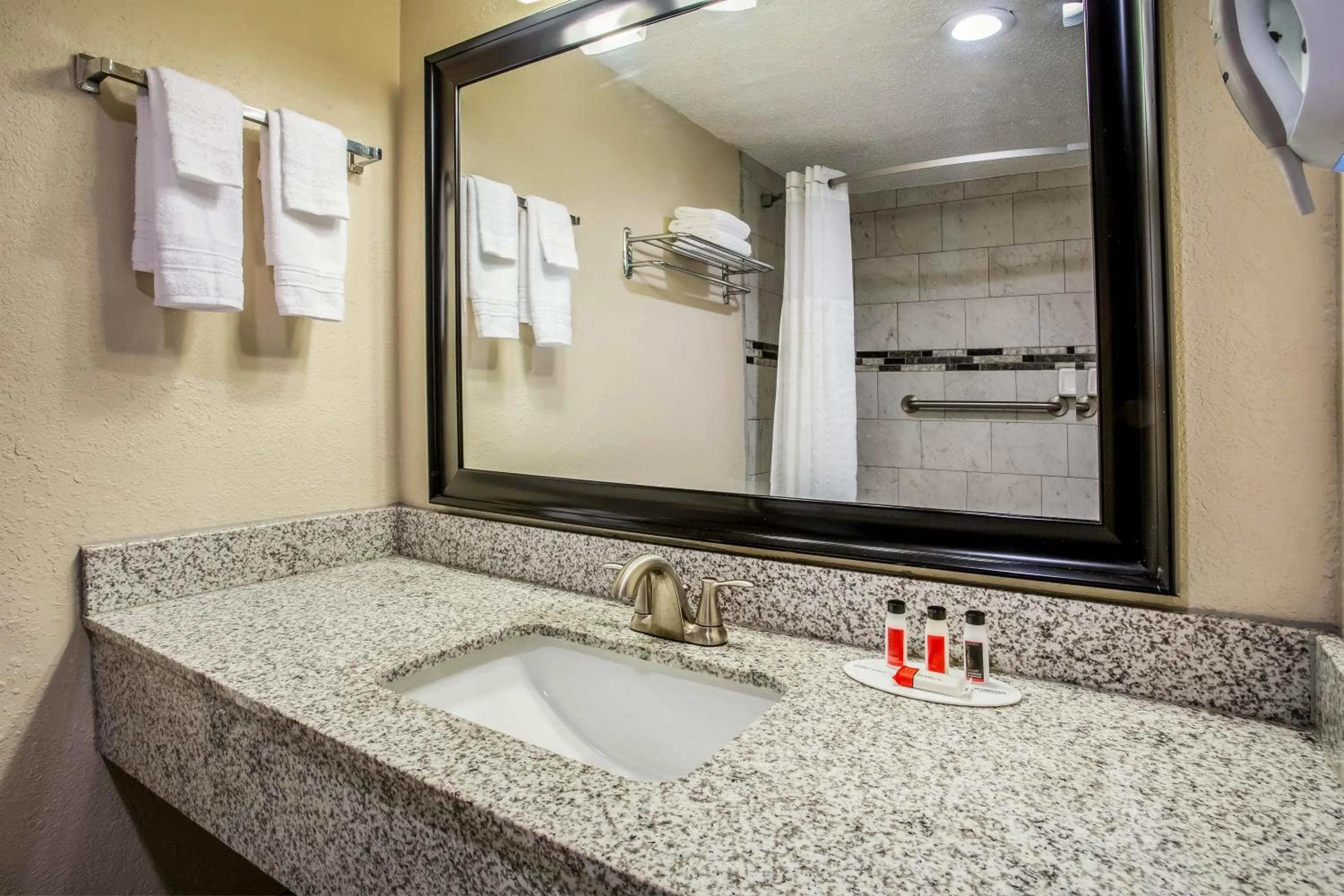 Bathroom in Super 8 by Wyndham Lake City