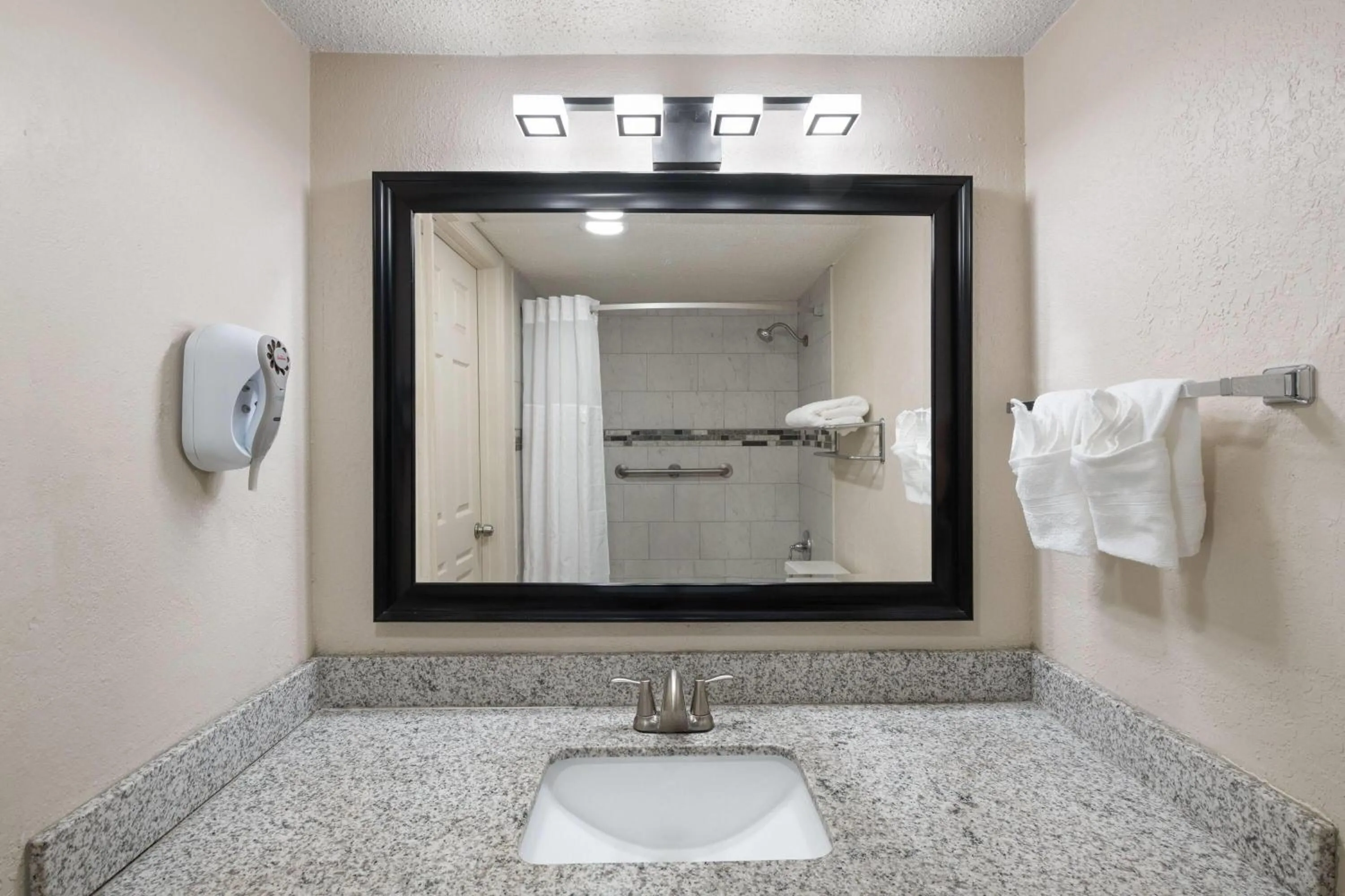 Bathroom in Super 8 by Wyndham Lake City