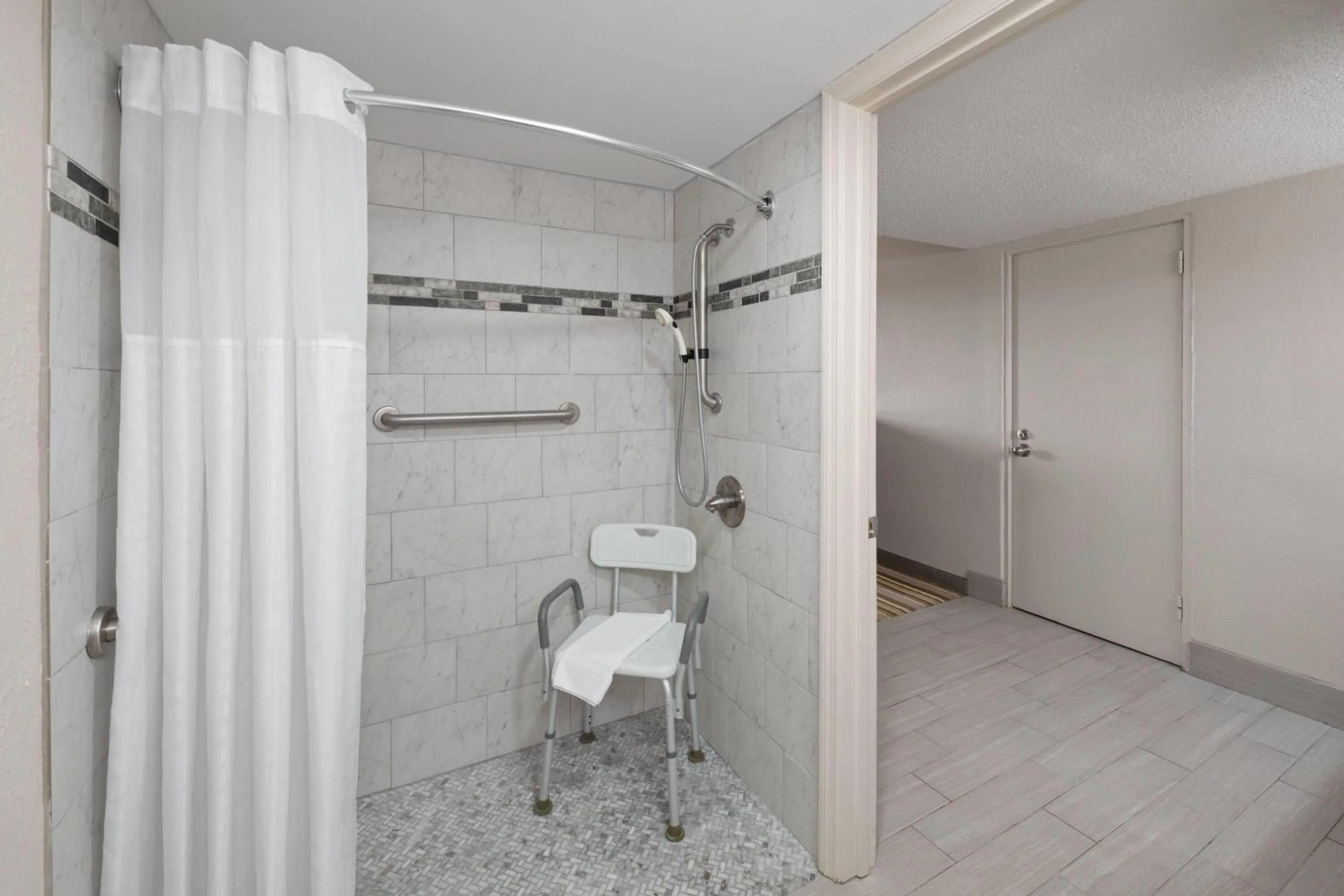 Shower in Super 8 by Wyndham Lake City