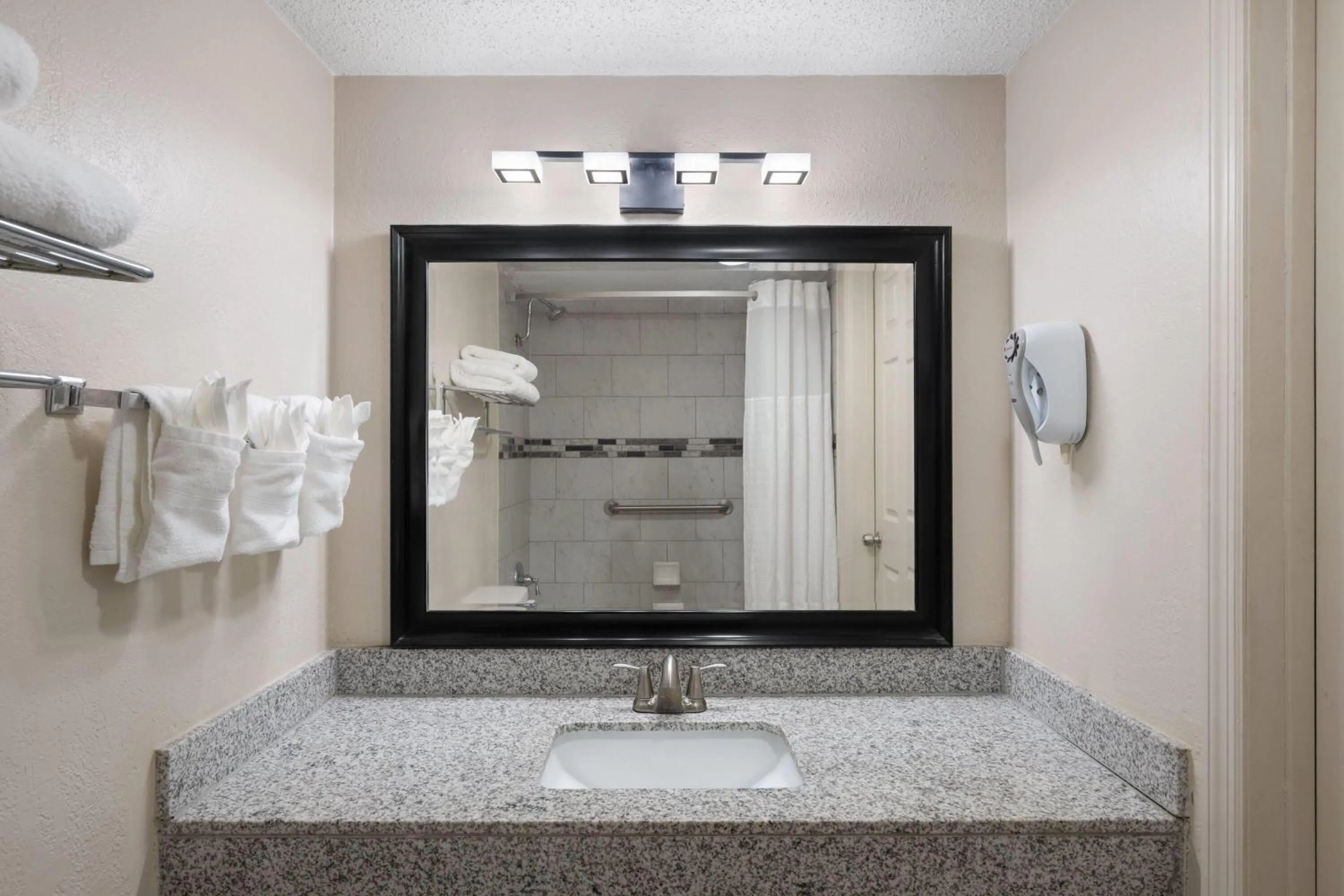 Bathroom in Super 8 by Wyndham Lake City