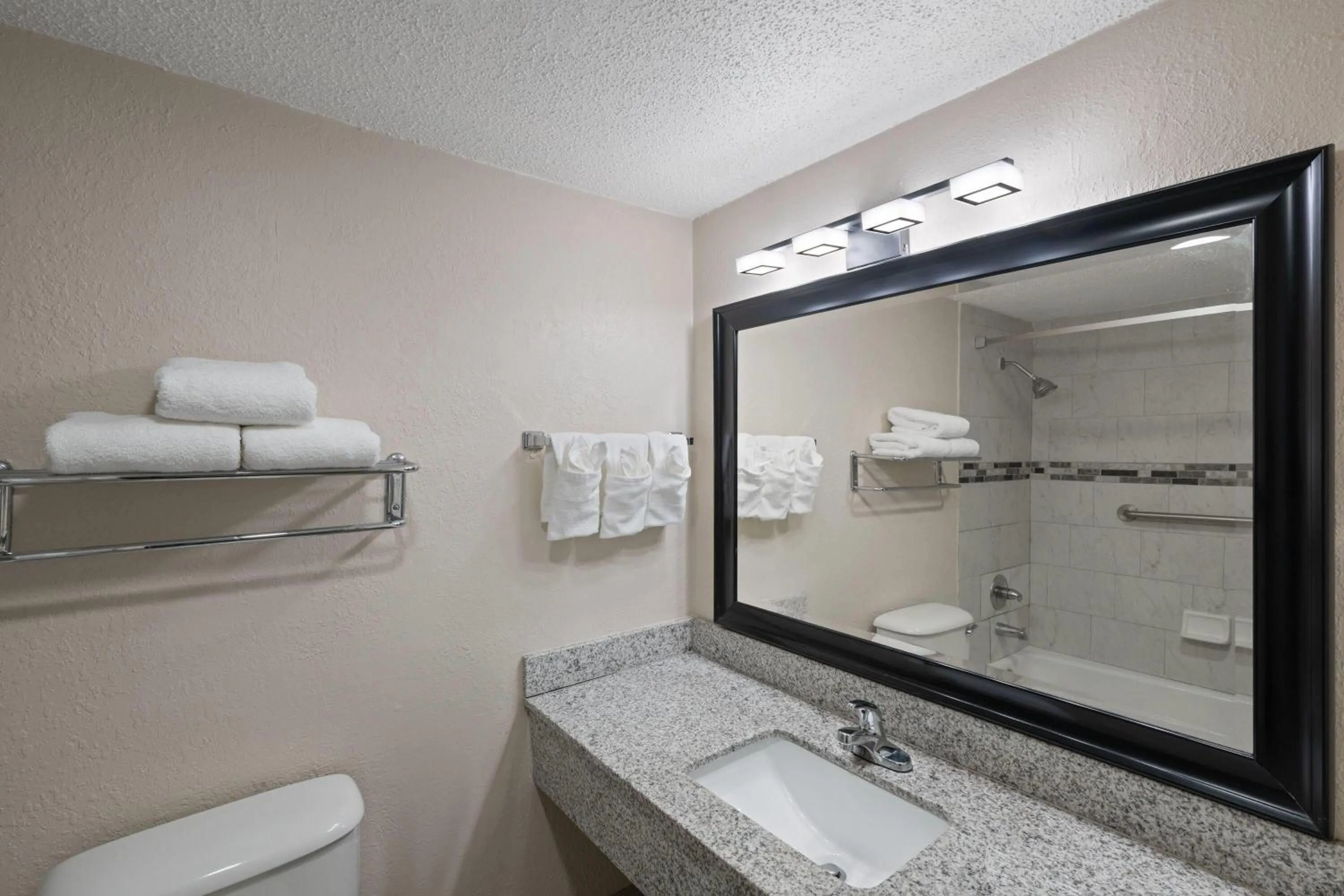 Bathroom in Super 8 by Wyndham Lake City