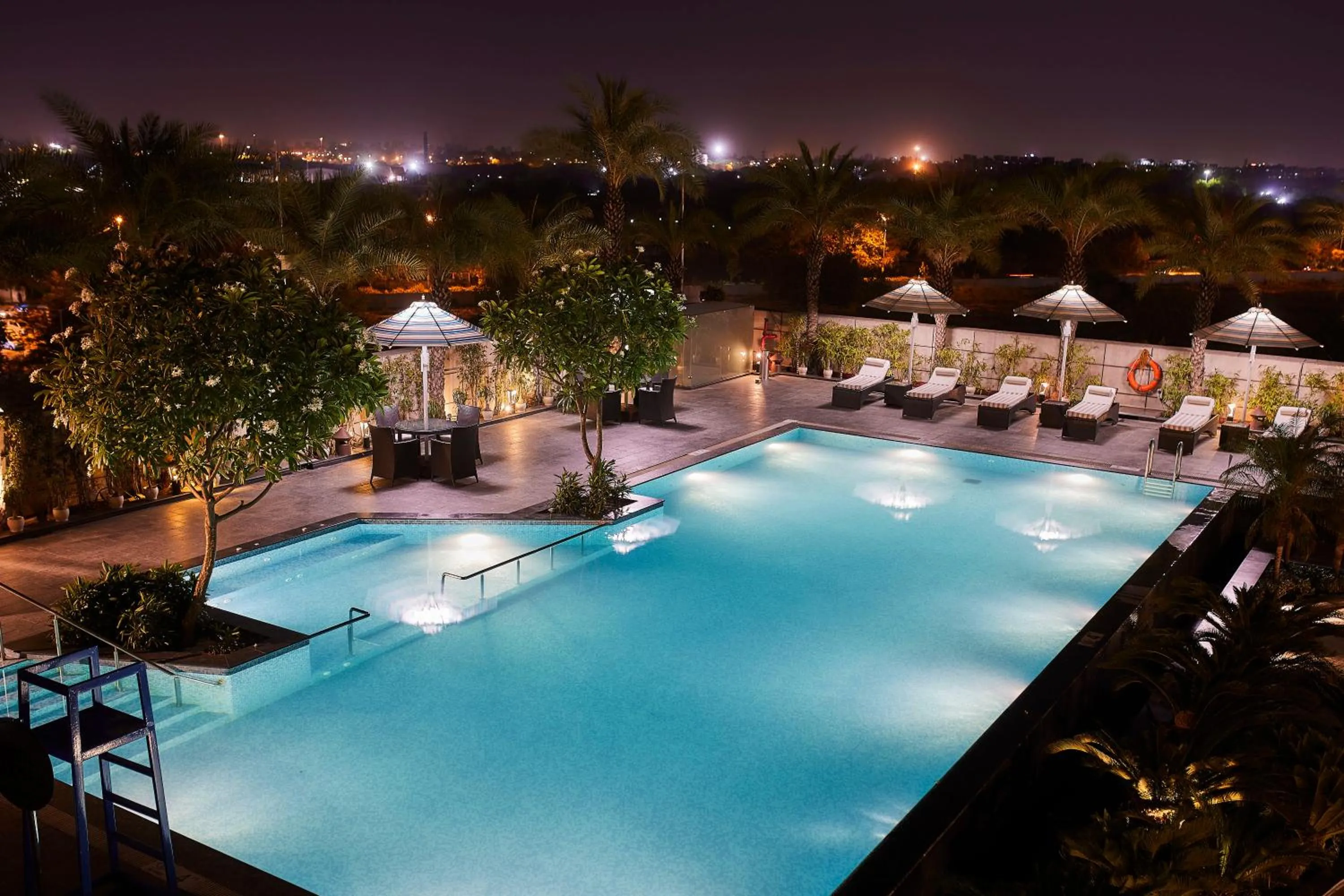 Swimming pool in Crowne Plaza New Delhi Rohini by IHG