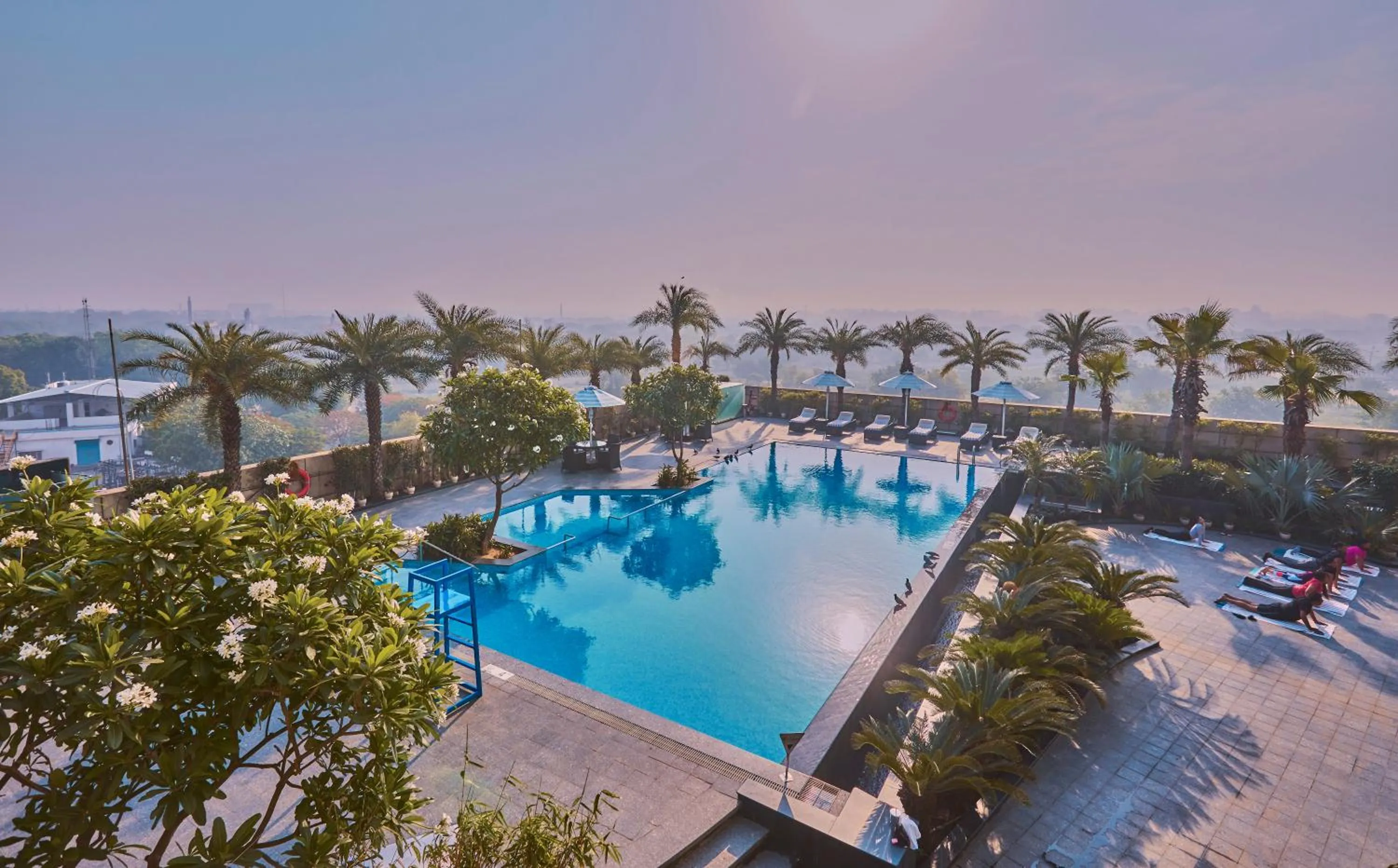 Swimming pool in Crowne Plaza New Delhi Rohini by IHG