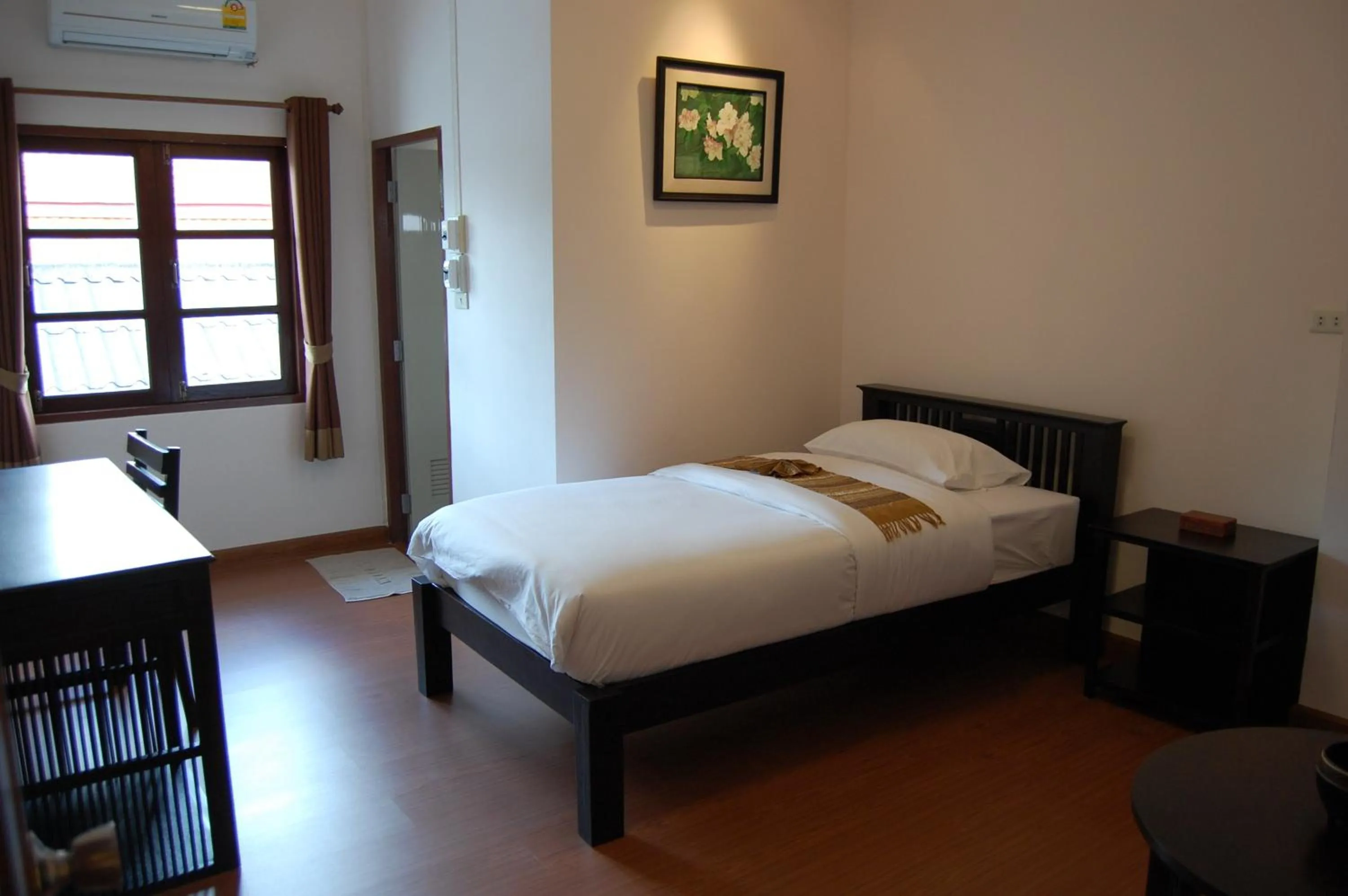 Bed in Baan Klang Vieng