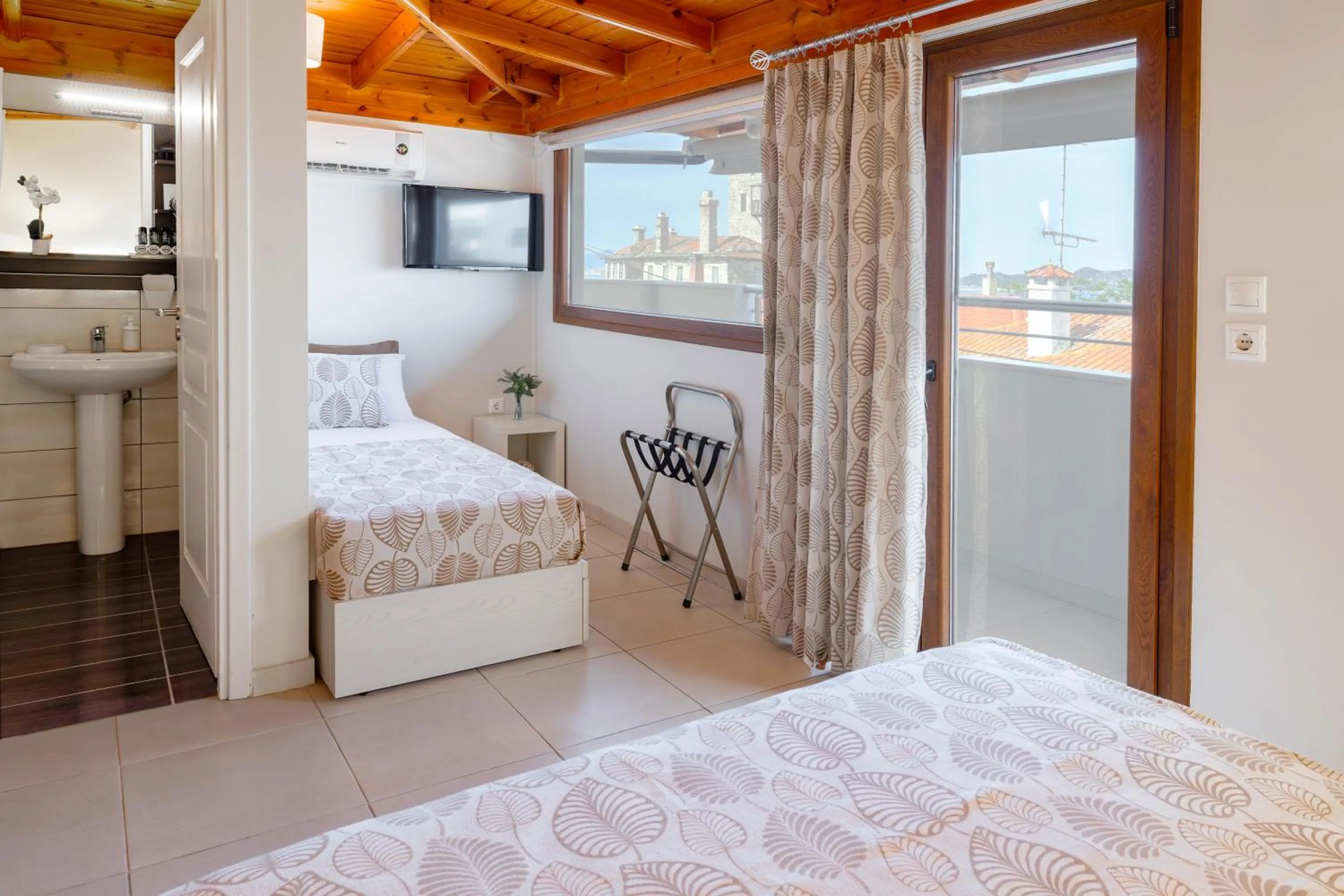 Bed in Athos Guest House Pansion