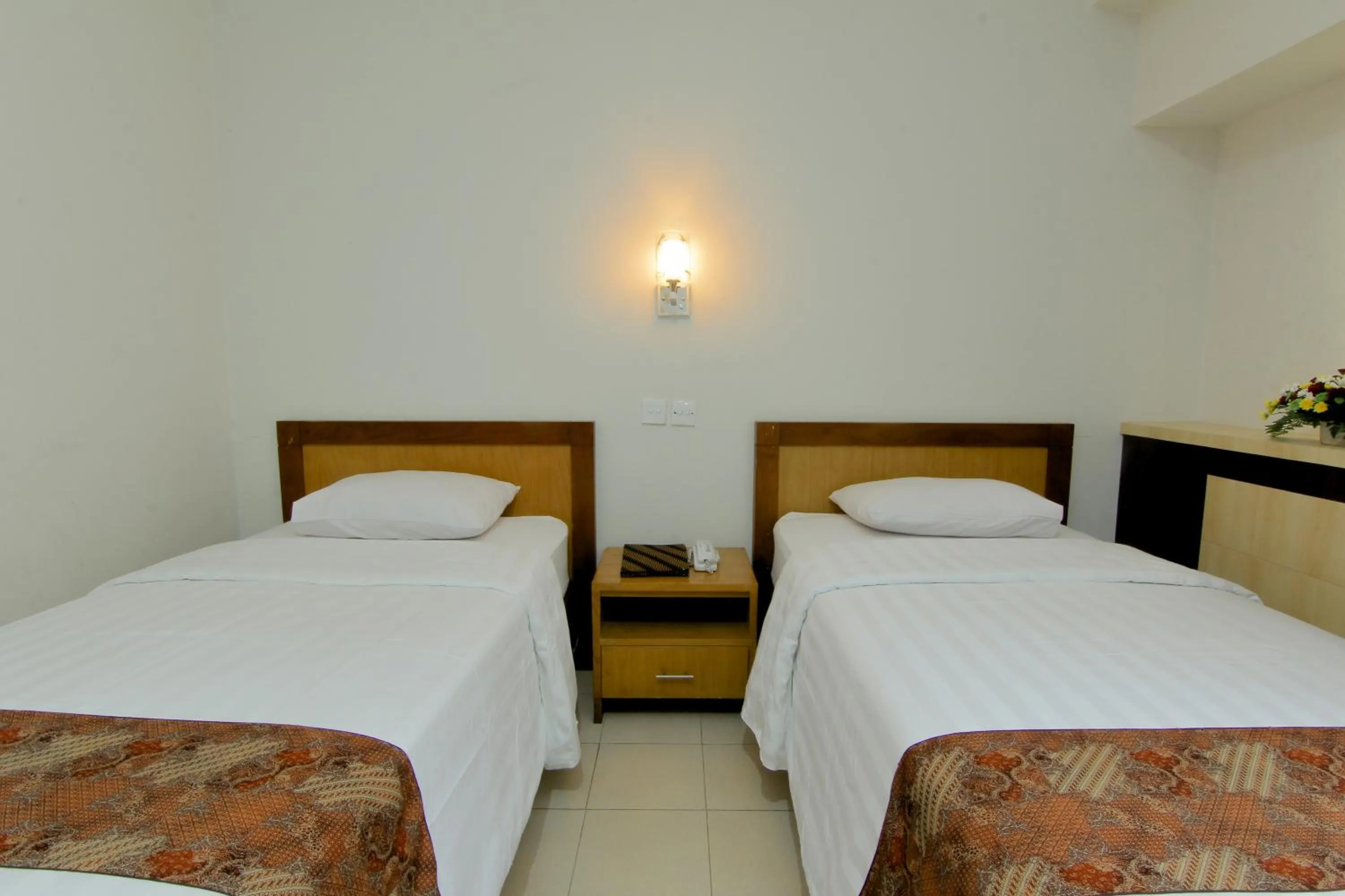 Bed in University Hotel Yogyakarta