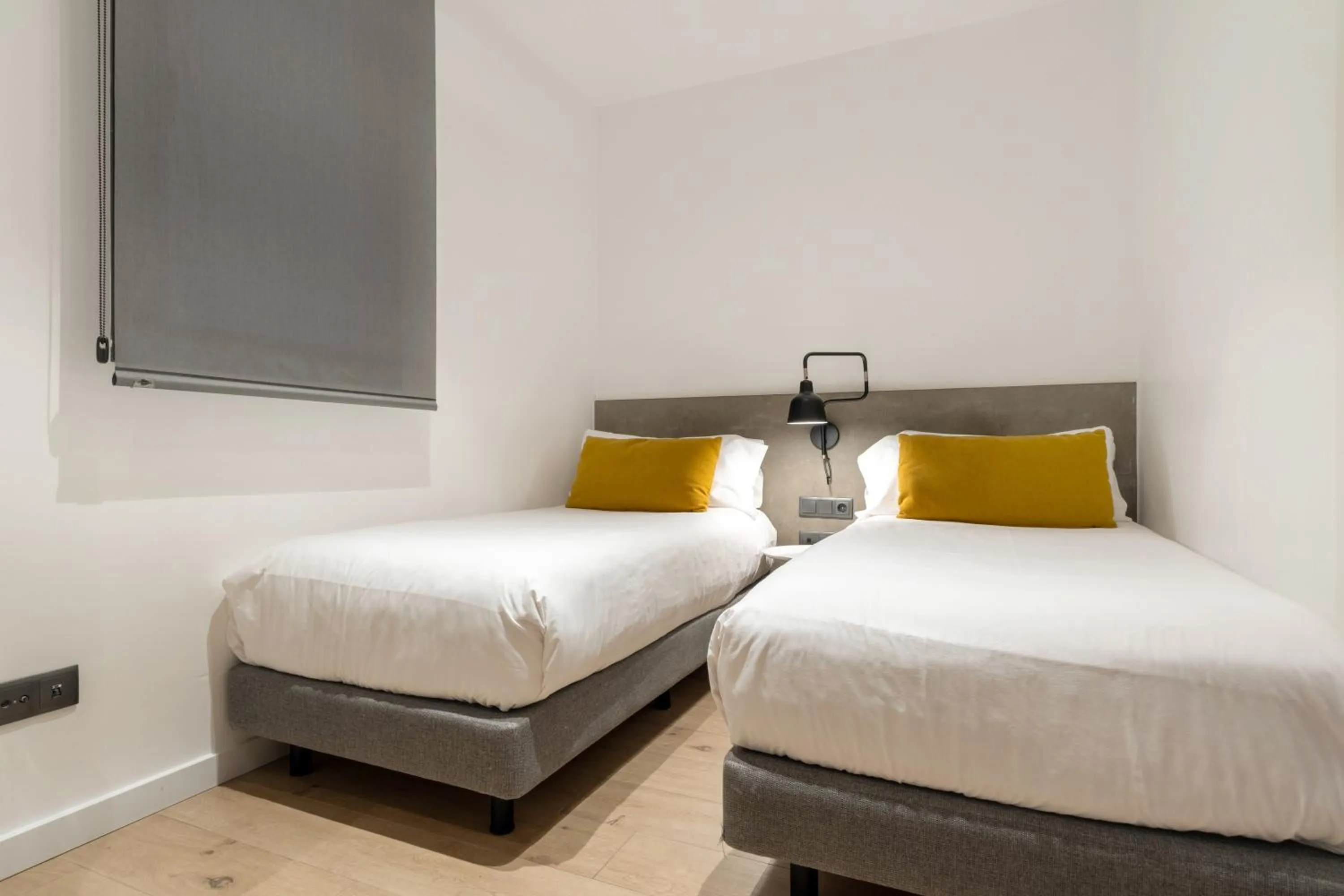 Bed in Aspasios Sagrada Familia Apartments