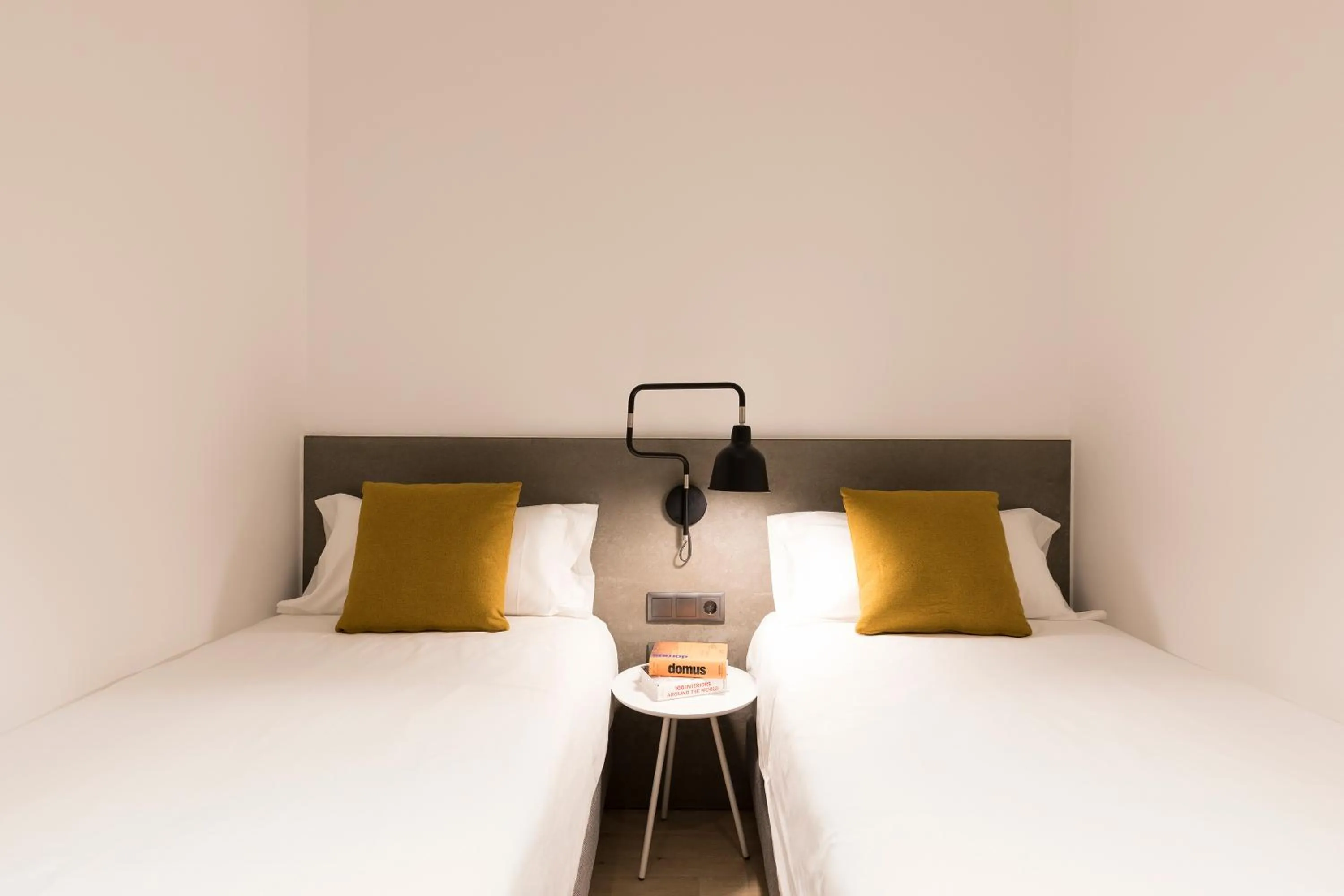 Bed in Aspasios Sagrada Familia Apartments