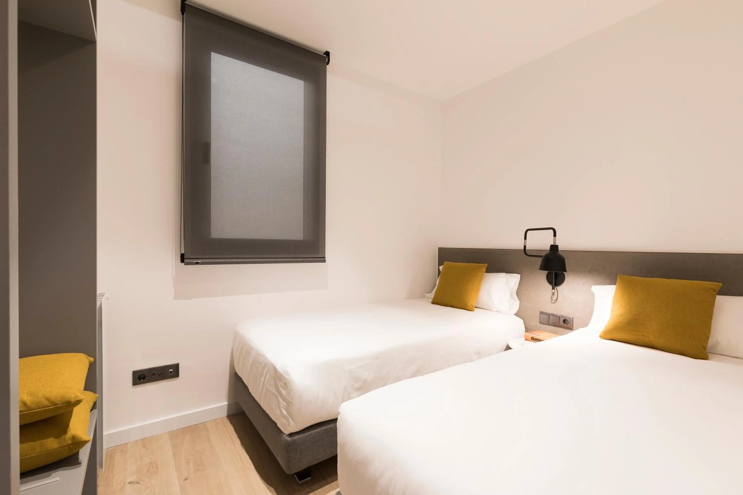 Bed in Aspasios Sagrada Familia Apartments