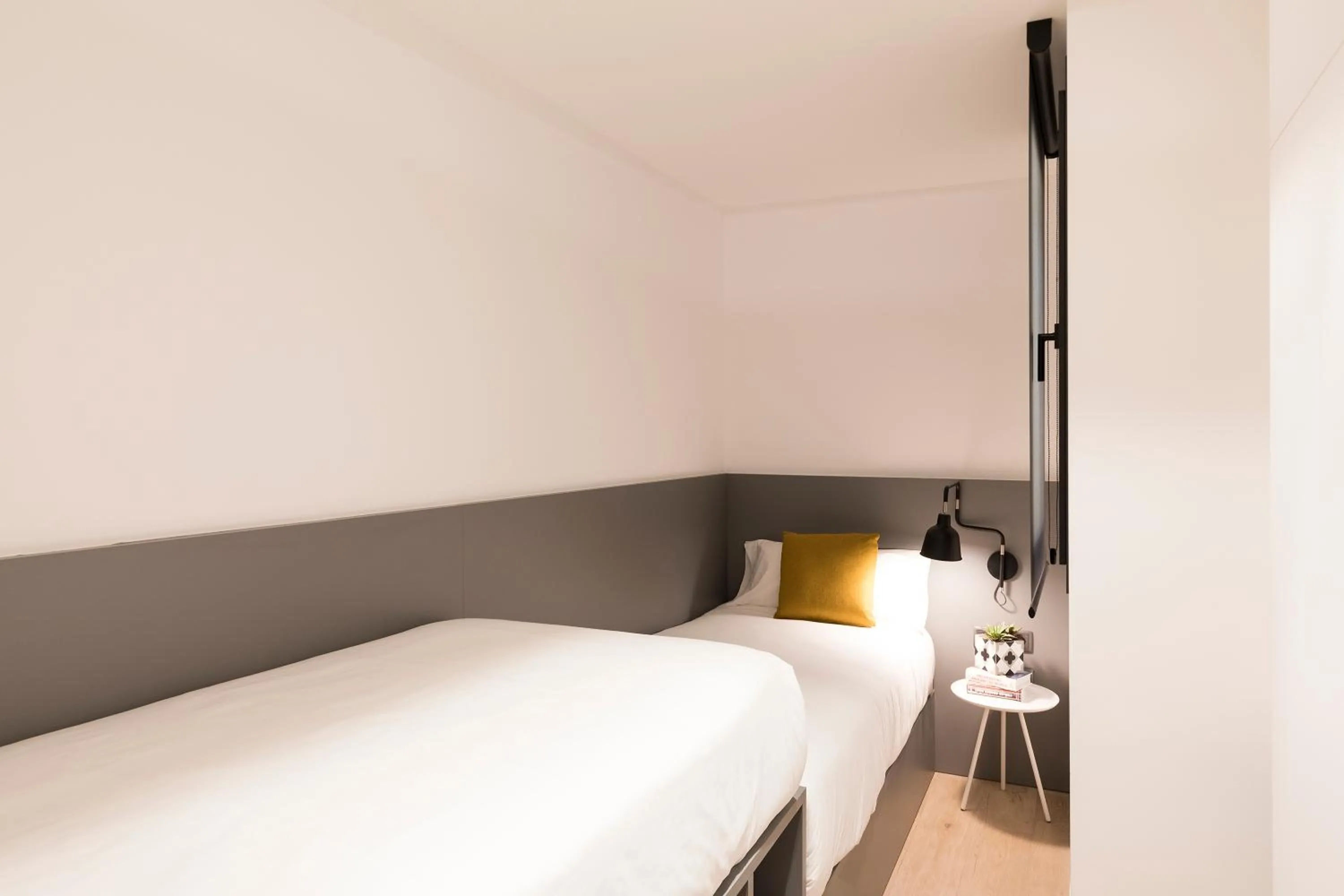 Bed in Aspasios Sagrada Familia Apartments