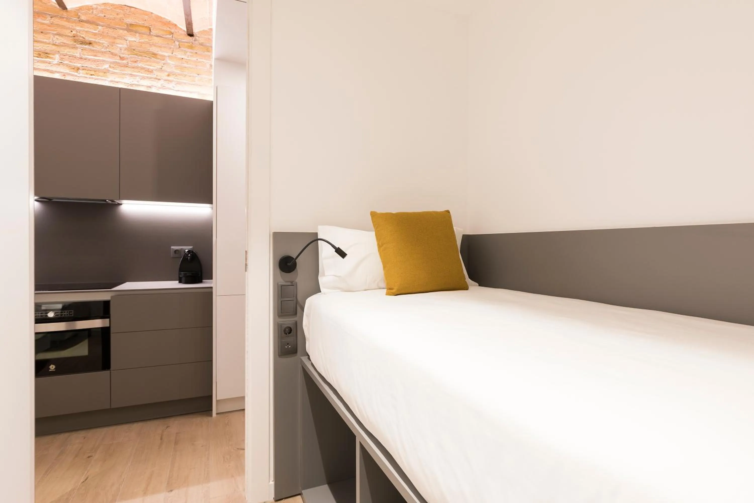 Bed in Aspasios Sagrada Familia Apartments