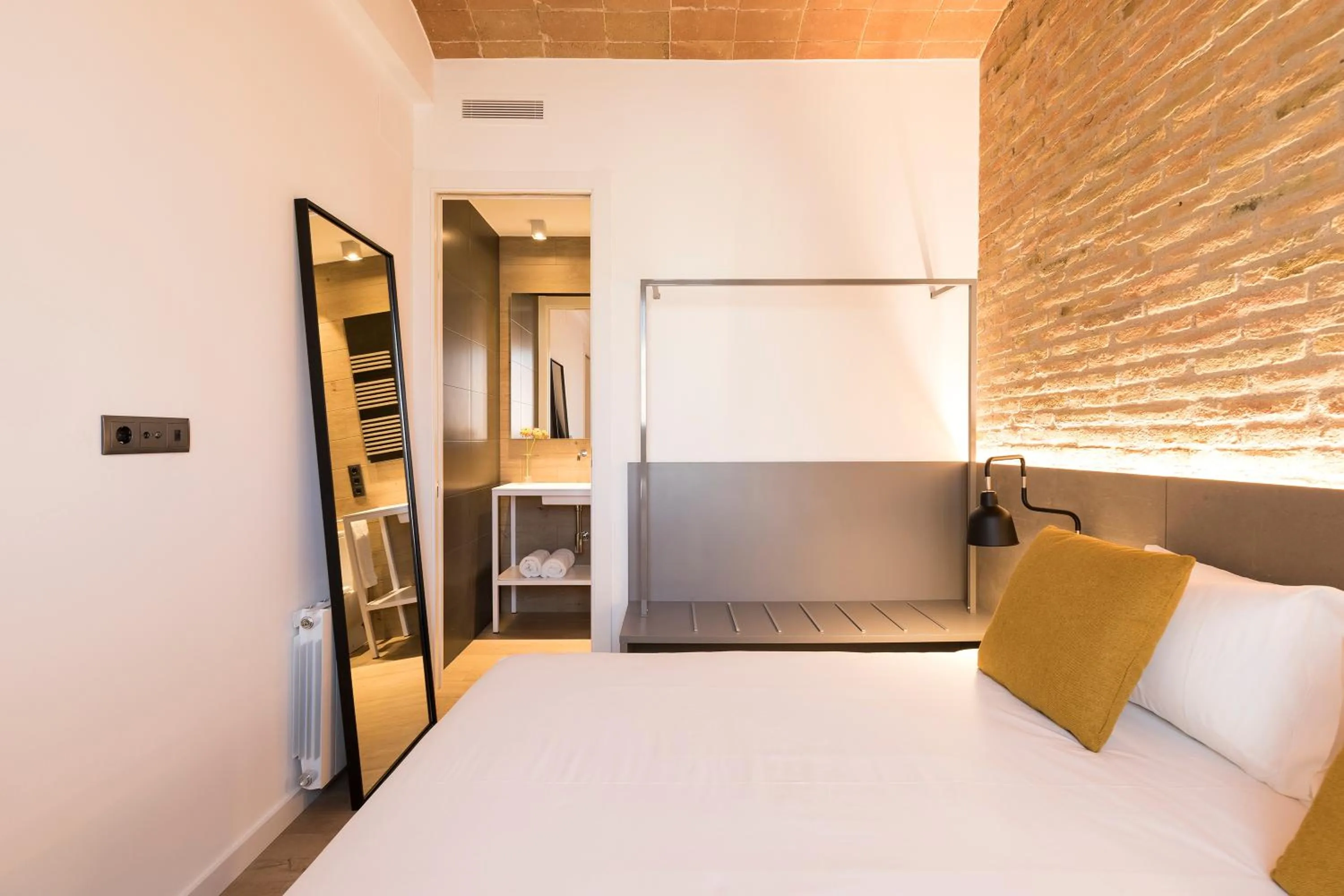 Bed in Aspasios Sagrada Familia Apartments