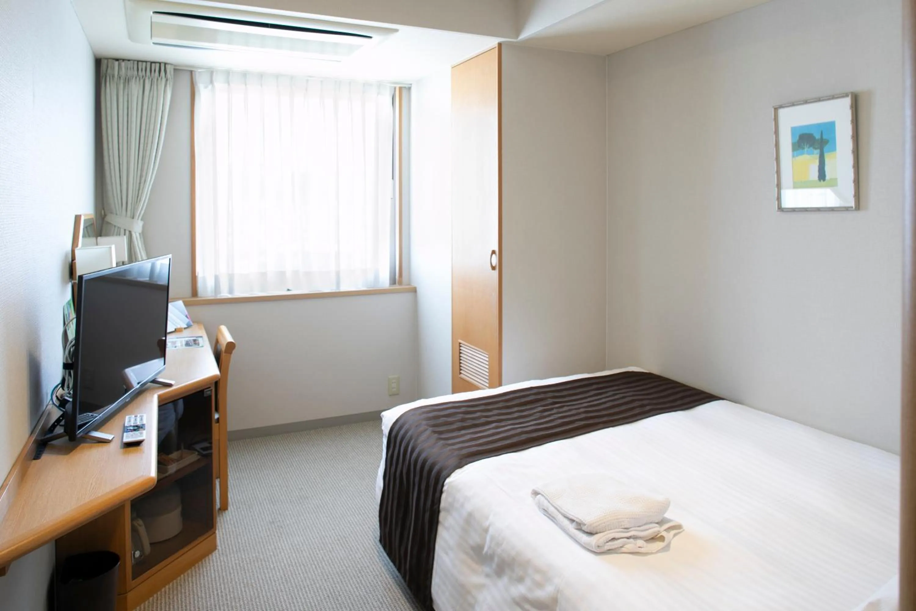 Bed in Hotel Plaza Annex Yokote