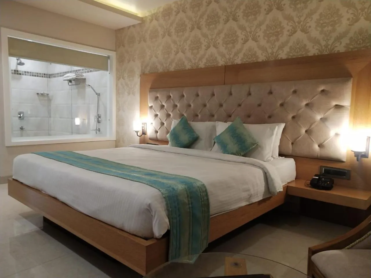 Bed in Hotel Kanha’s Palm Springs