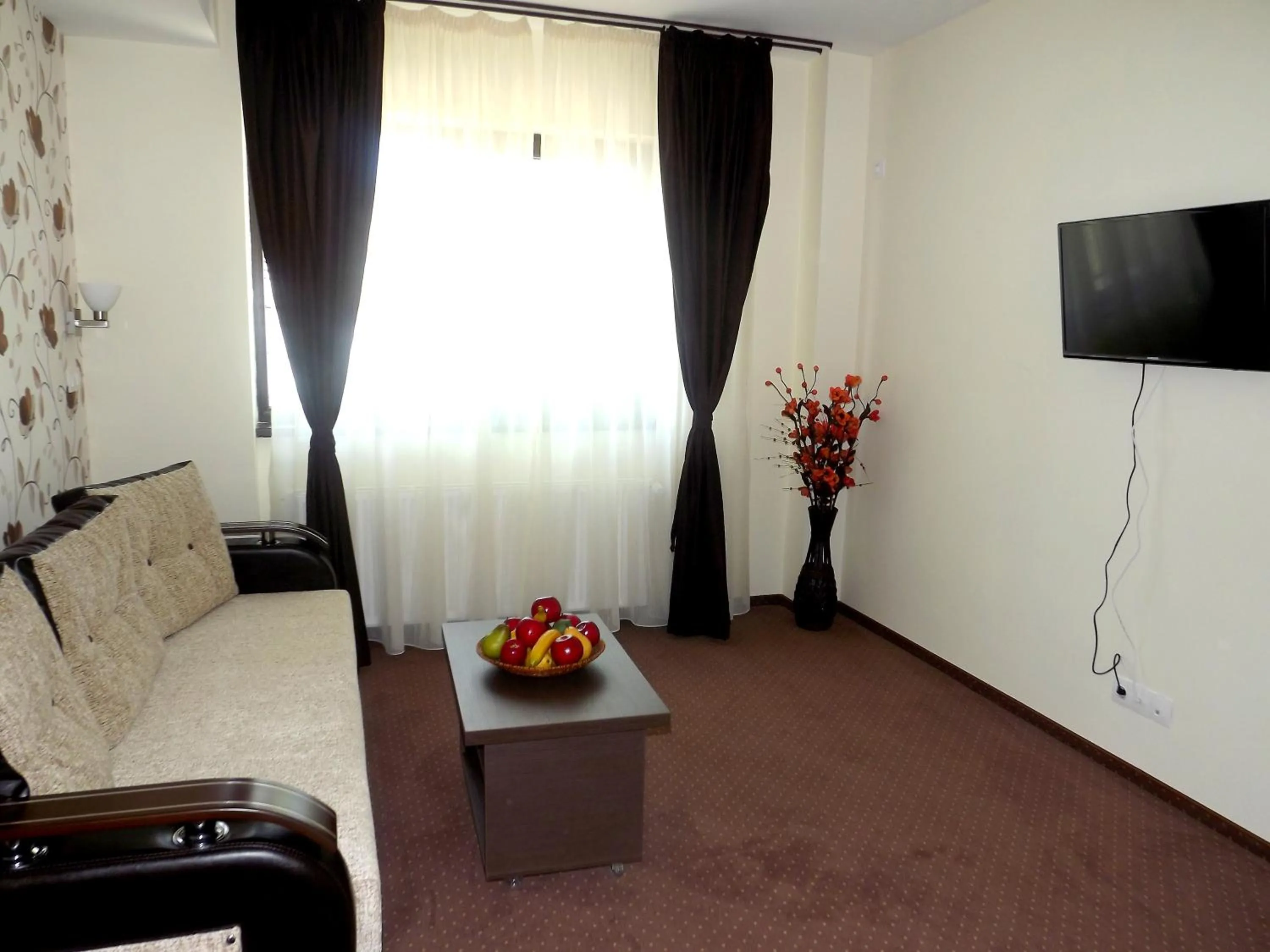 Living room in West Plaza Hotel