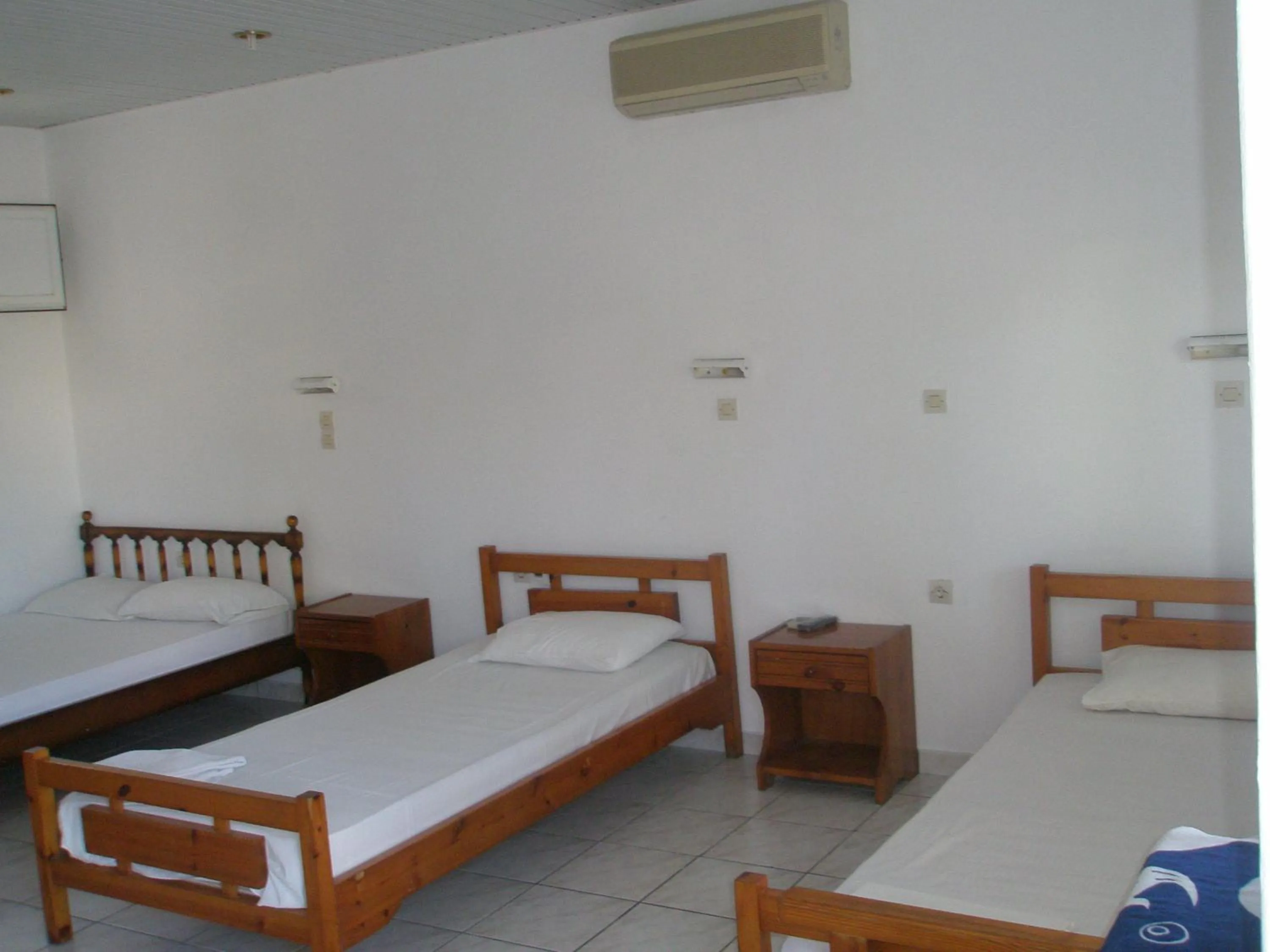 Bed in Nitsa Rooms