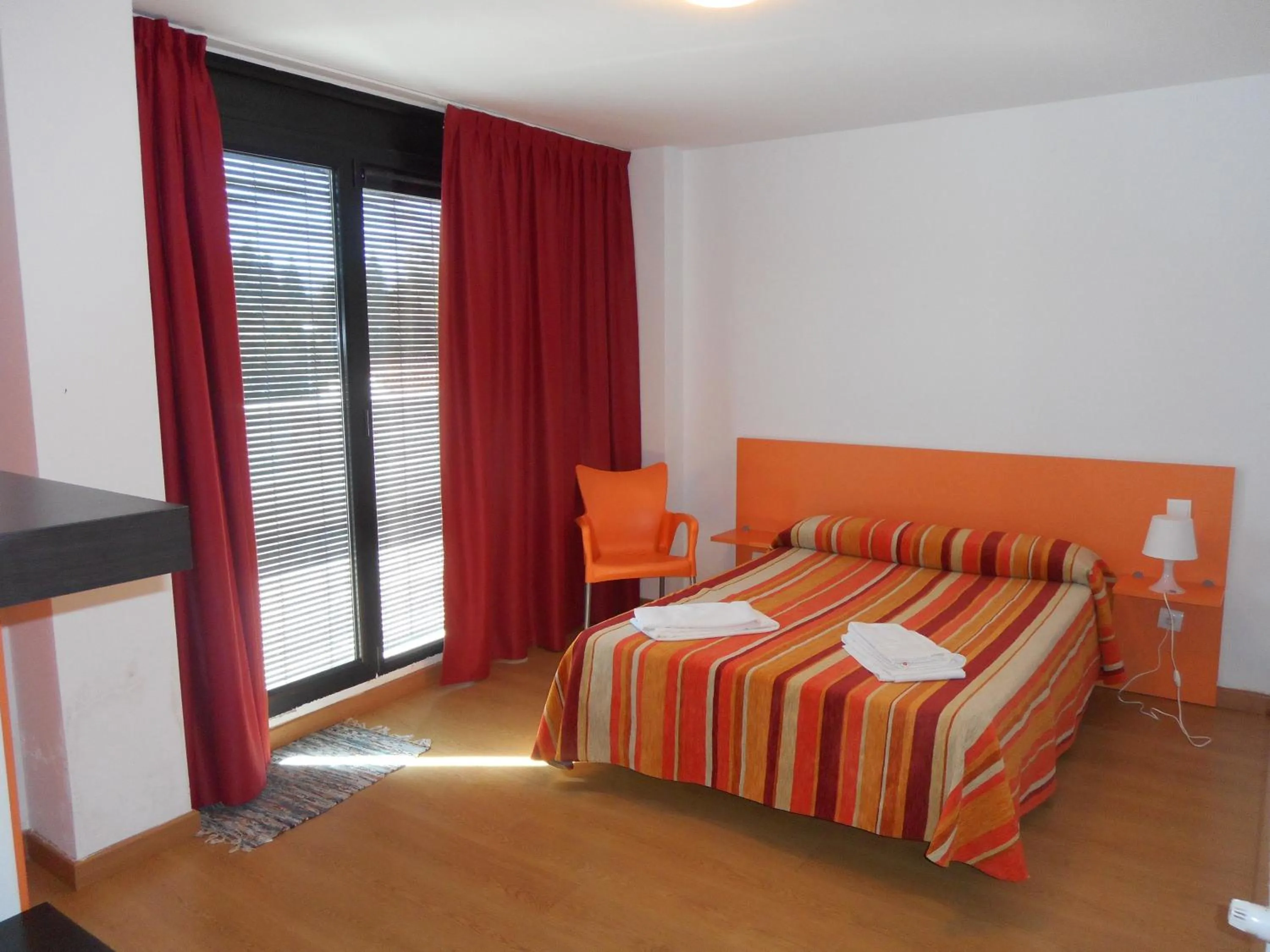 Bedroom, Bed in Apartamentos Bahía de Boó