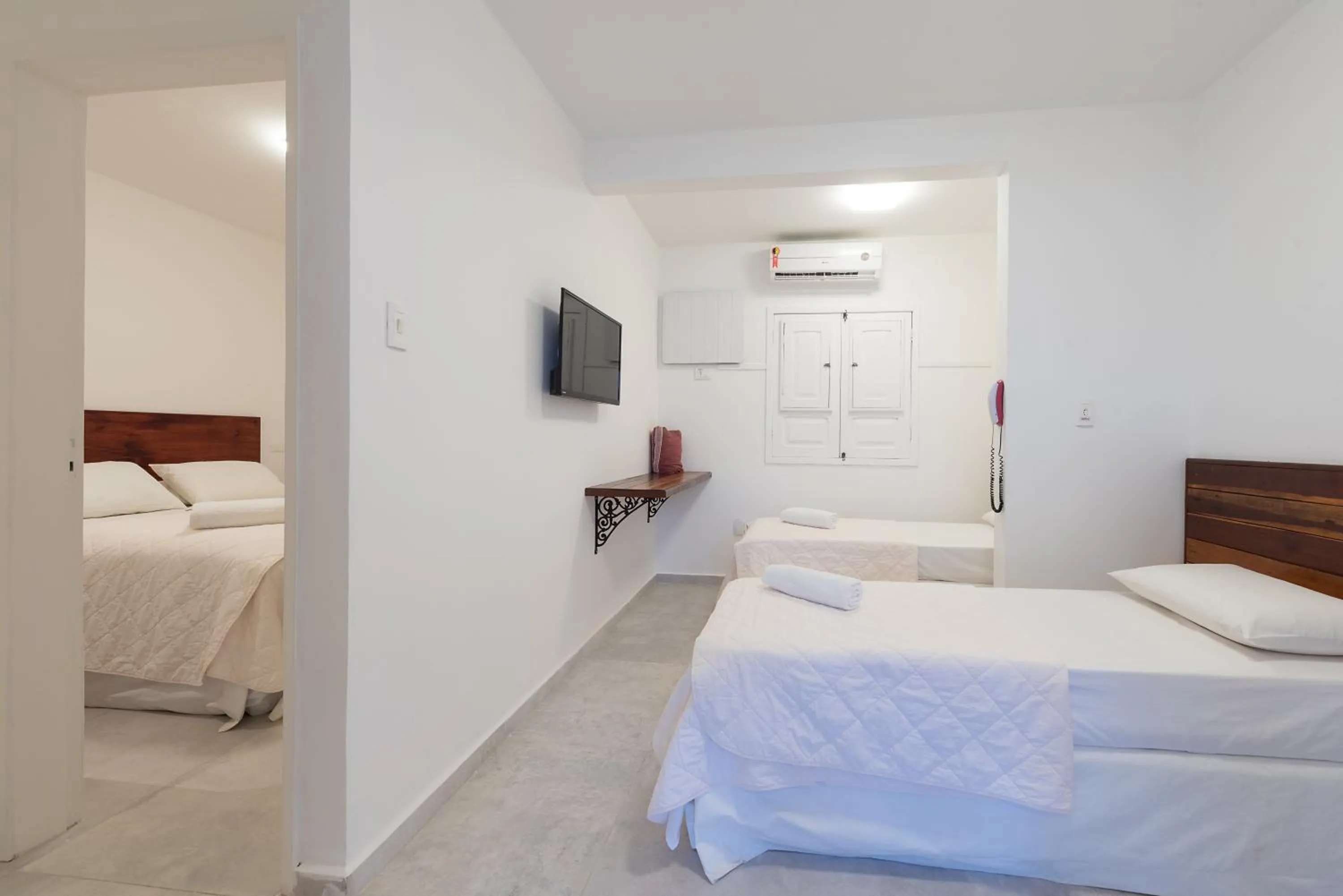 Bed in Pousada Quatro Estações